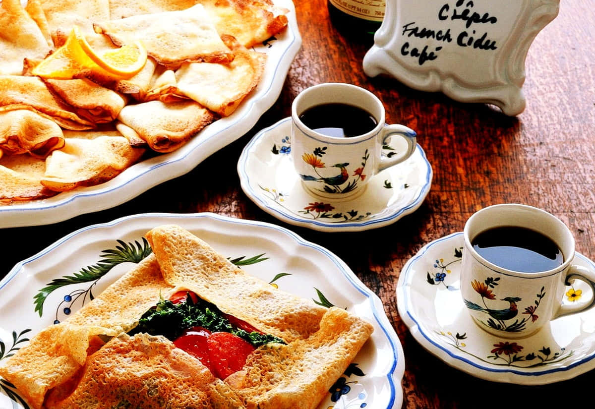 golden crepes, vibrant tomato and greens, two cups of coffee, SD Desktop Wallpaper