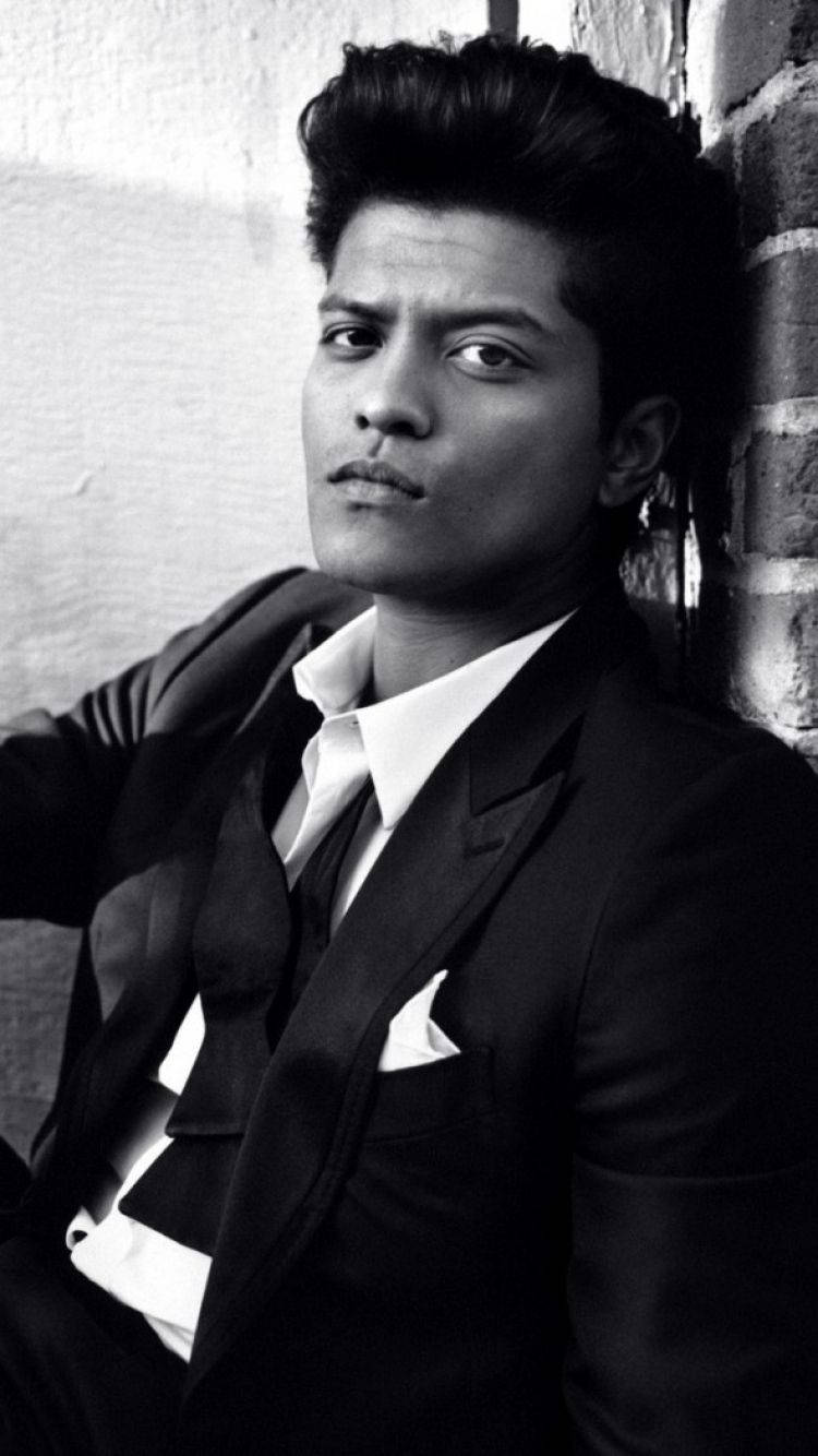 Bruno Mars, black suit, brick wall, HD Phone Wallpaper