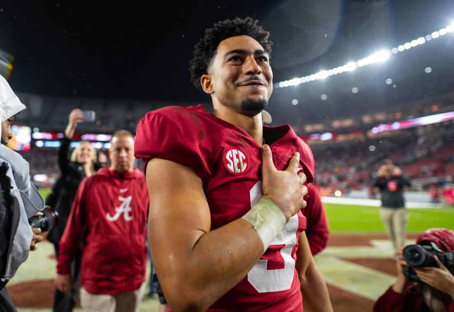 Bryce Young, crimson jersey, lit field at night, HD Desktop Wallpaper