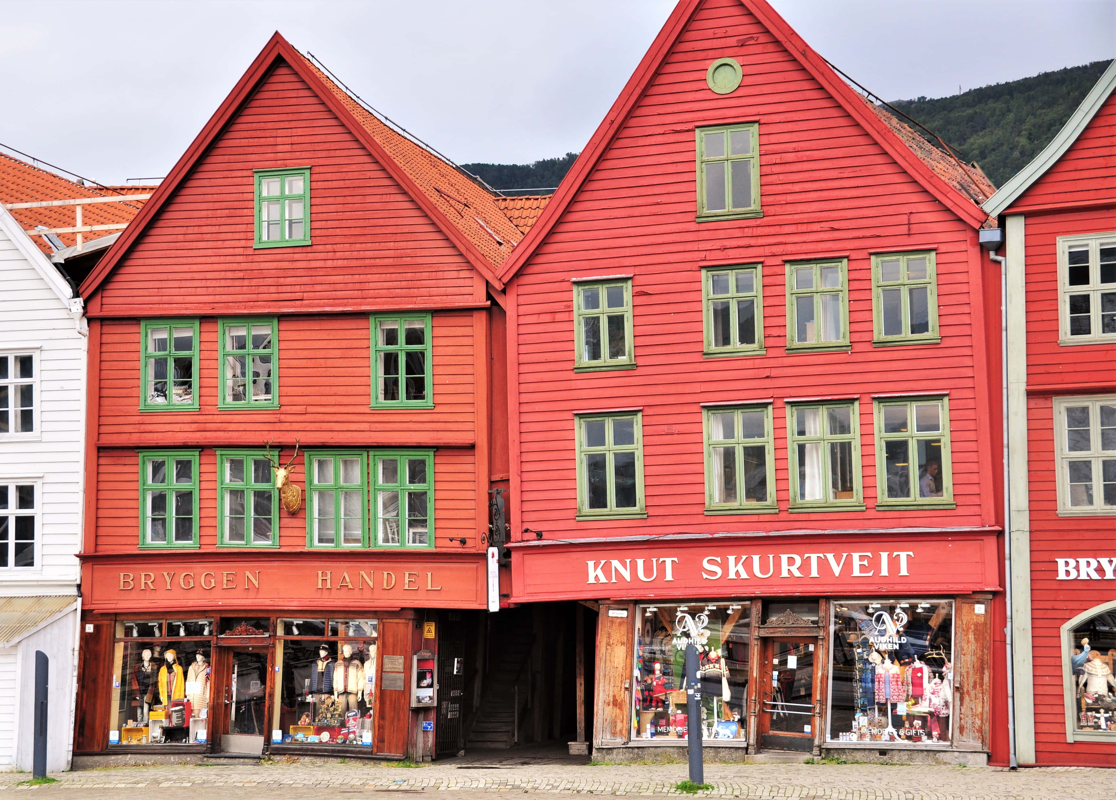 Bryggen, traditional Norwegian shops, vibrant red wooden buildings, 4K Desktop Wallpaper
