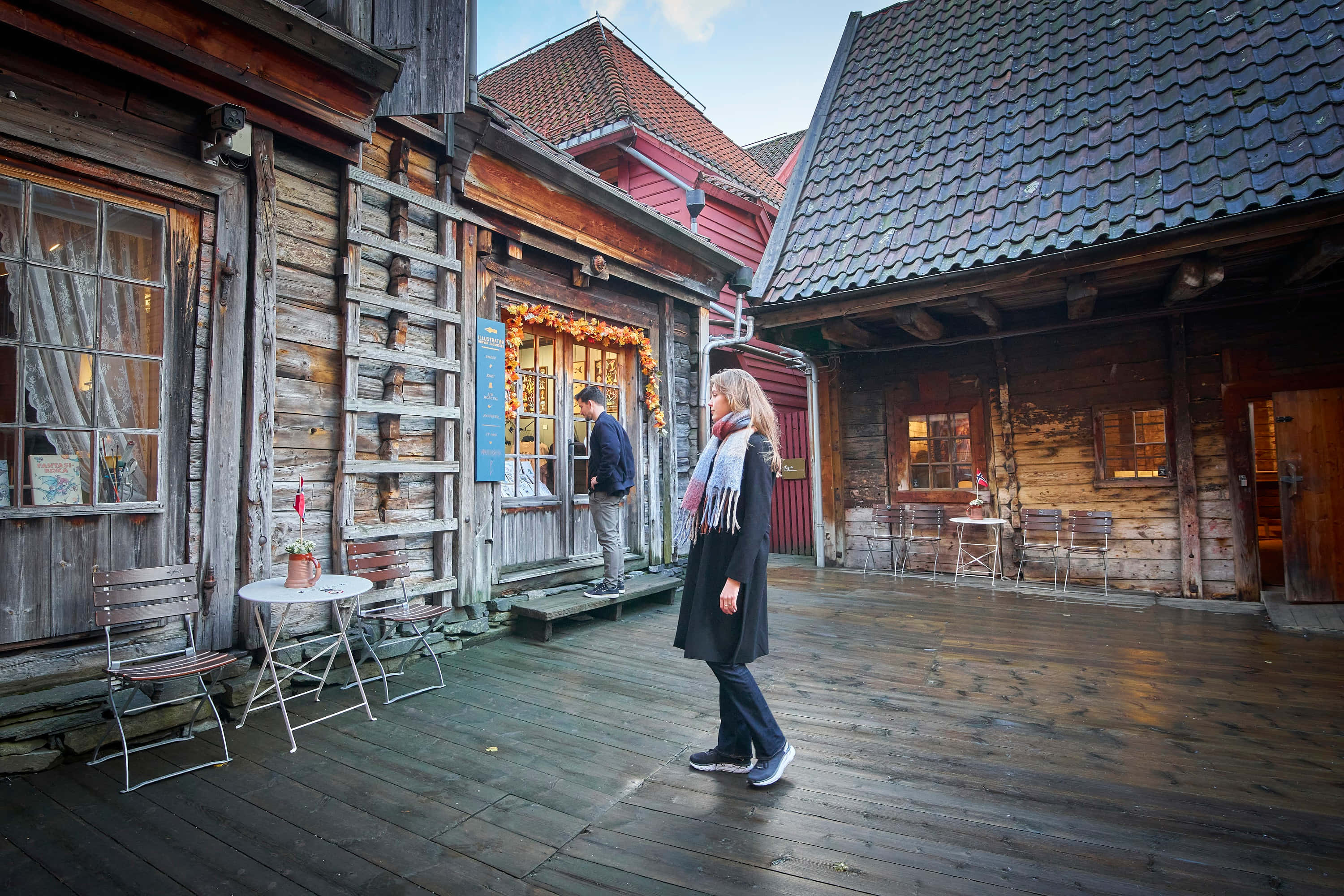 Bryggen, weathered wooden courtyard, rustic timber buildings, 2K Desktop Wallpaper