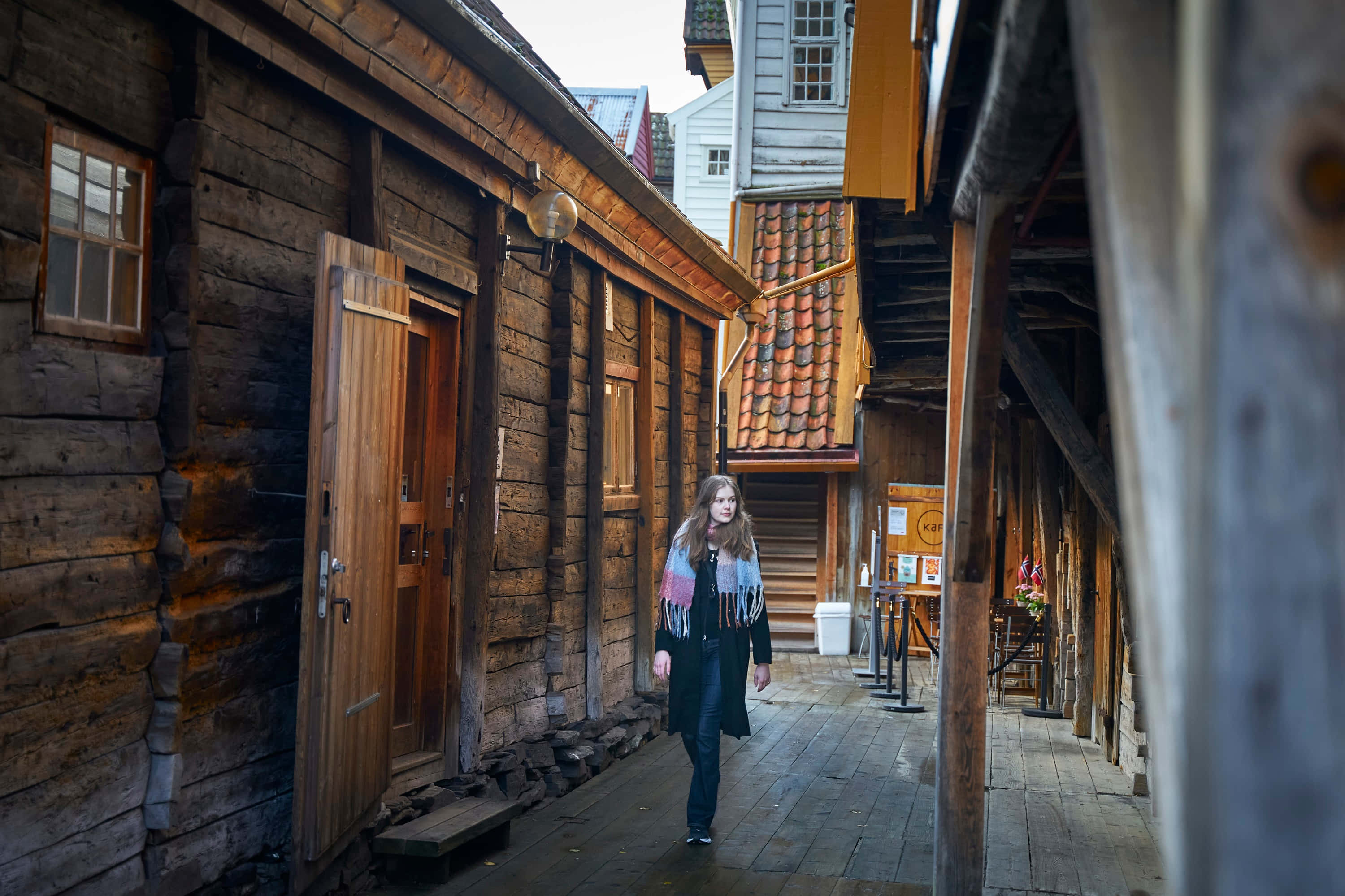 Bryggen, narrow wooden alleyway, historic log buildings, 2K Desktop Wallpaper