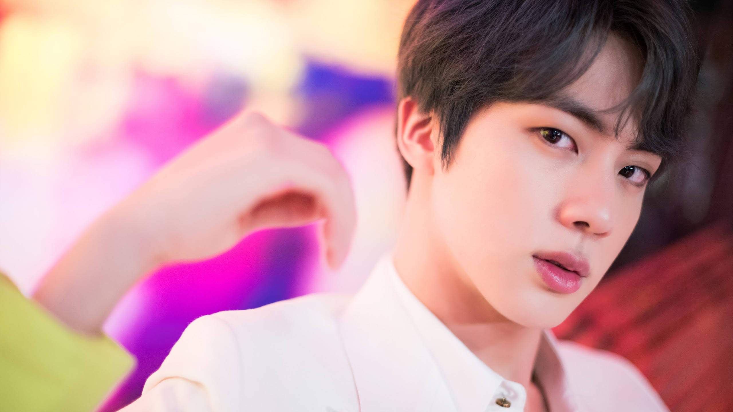 BTS Jin, white shirt, vibrant colorful blurred background, 2K Desktop Wallpaper