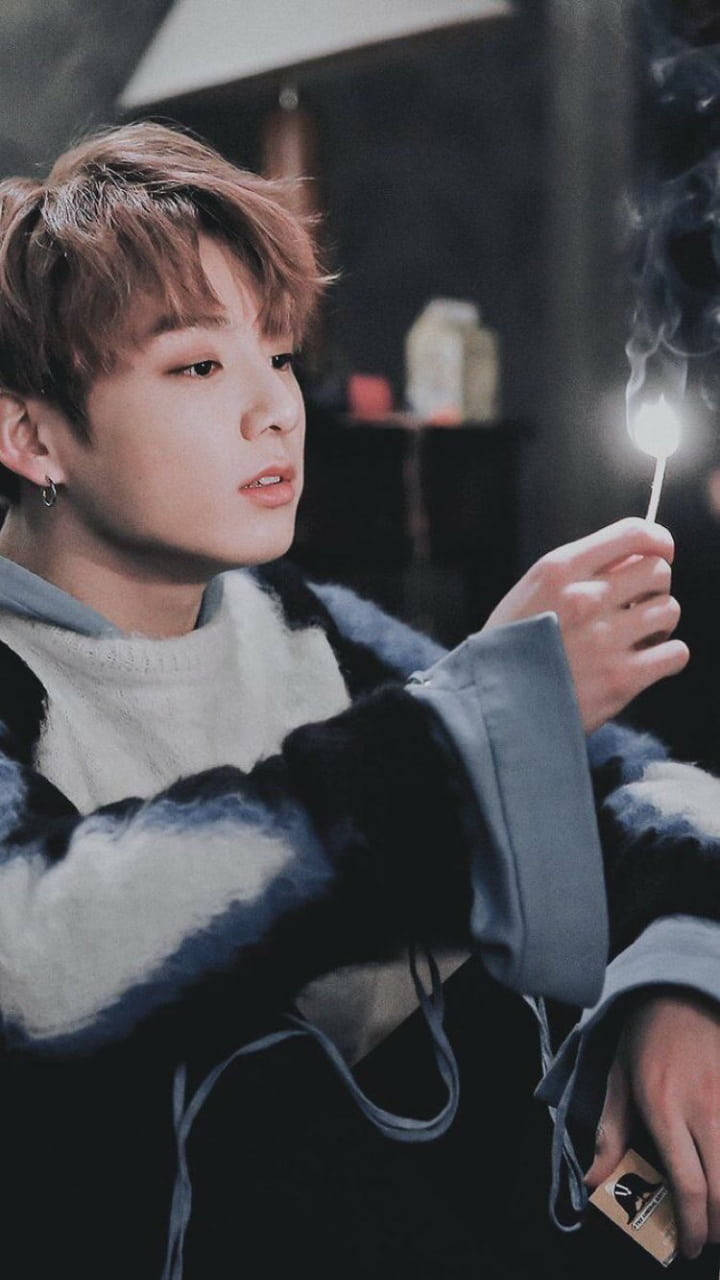 BTS Jung Kook, light brown hair, lit match, HD Phone Wallpaper