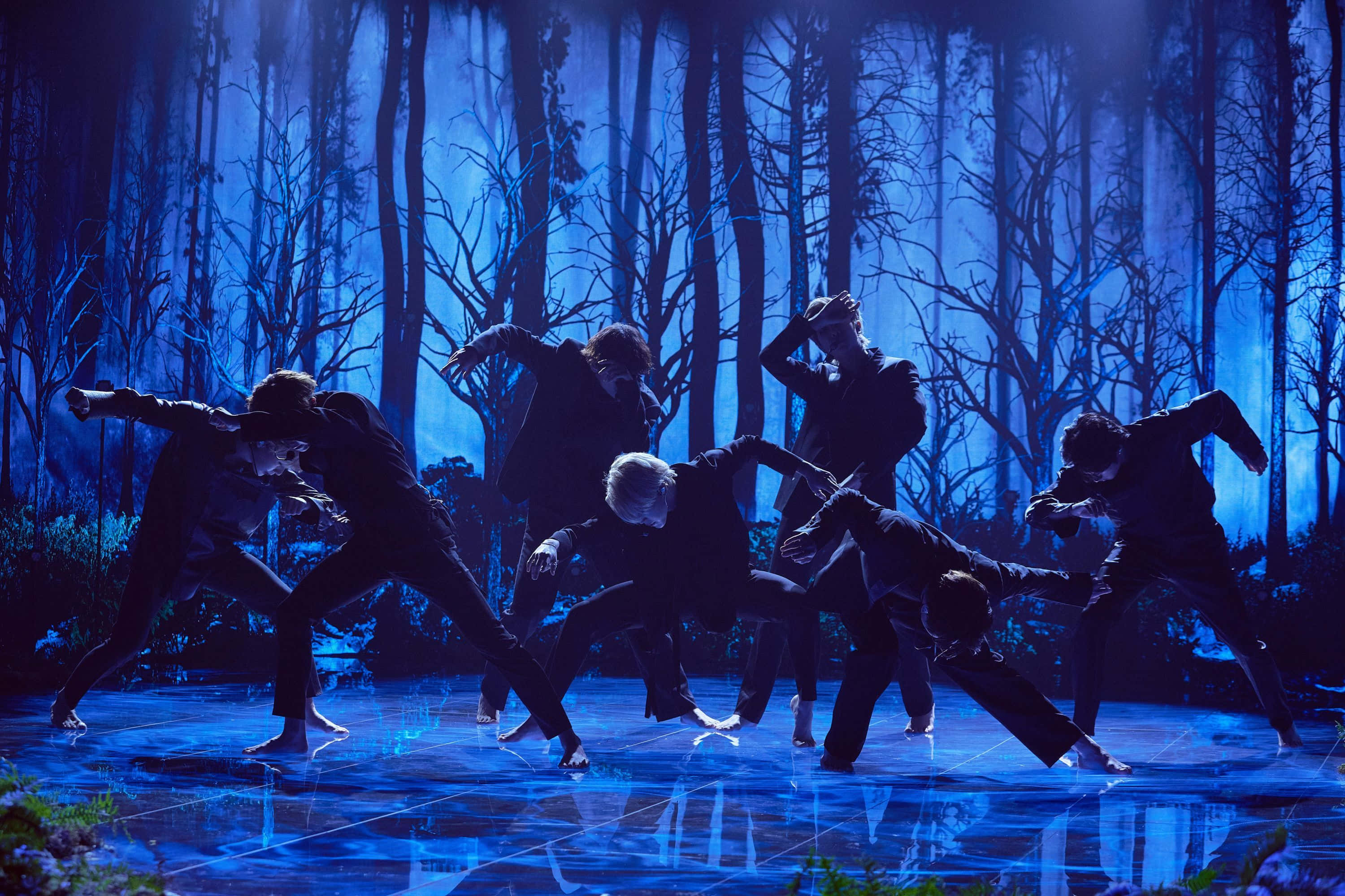 BTS, glowing blue stage, misty forest backdrop, 2K Desktop Wallpaper