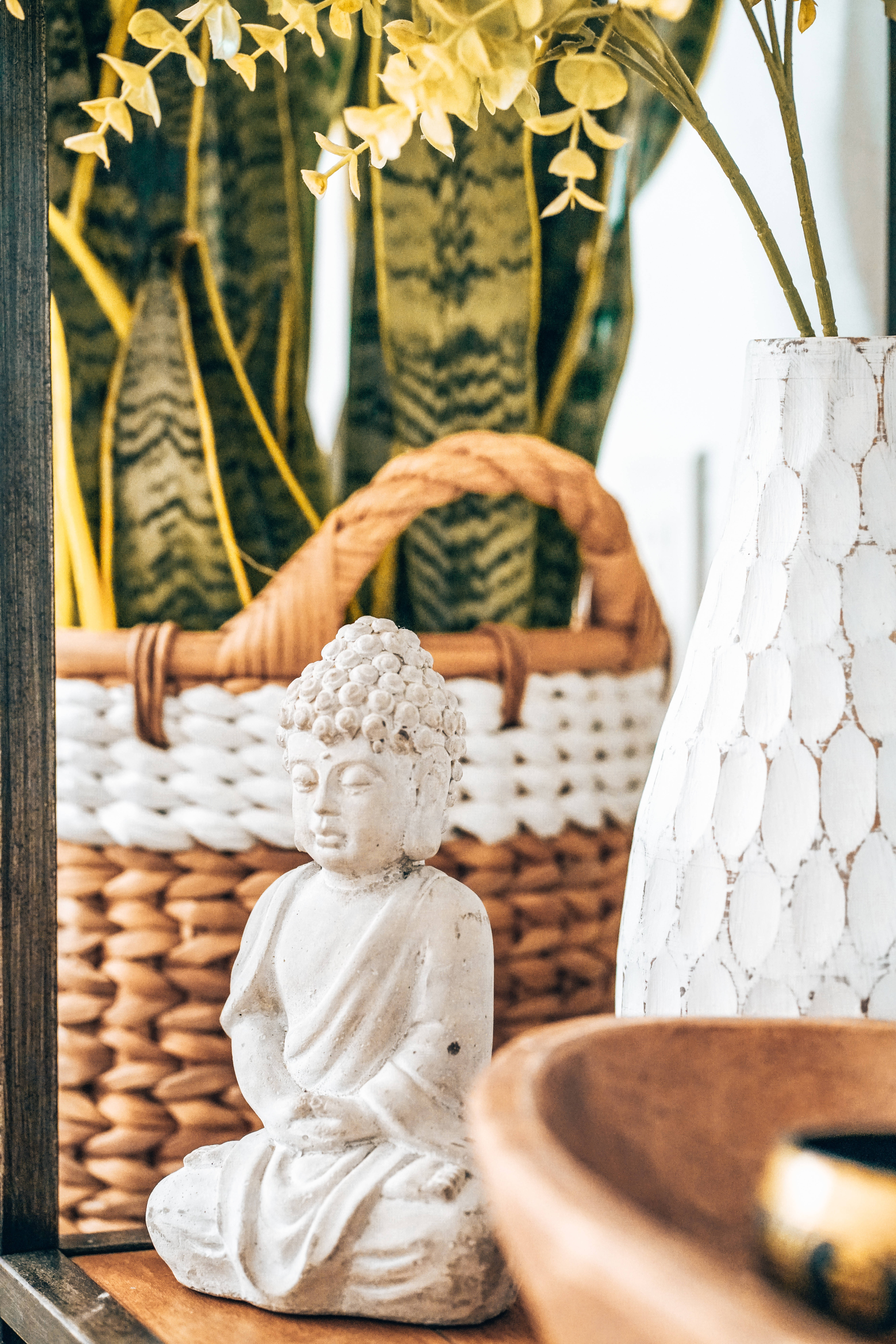 white Buddha figurine, serene white Buddha statue, woven basket, 8K Phone Wallpaper
