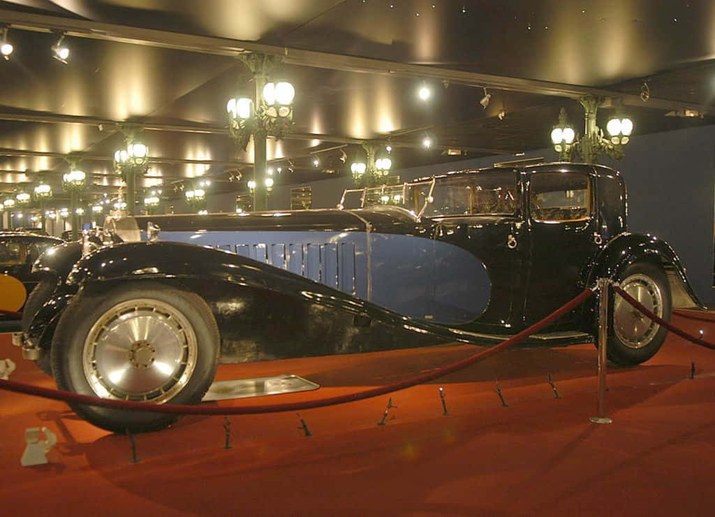Bugatti Type 41 Royale, sleek black and blue, warm chandeliers, SD Desktop Wallpaper
