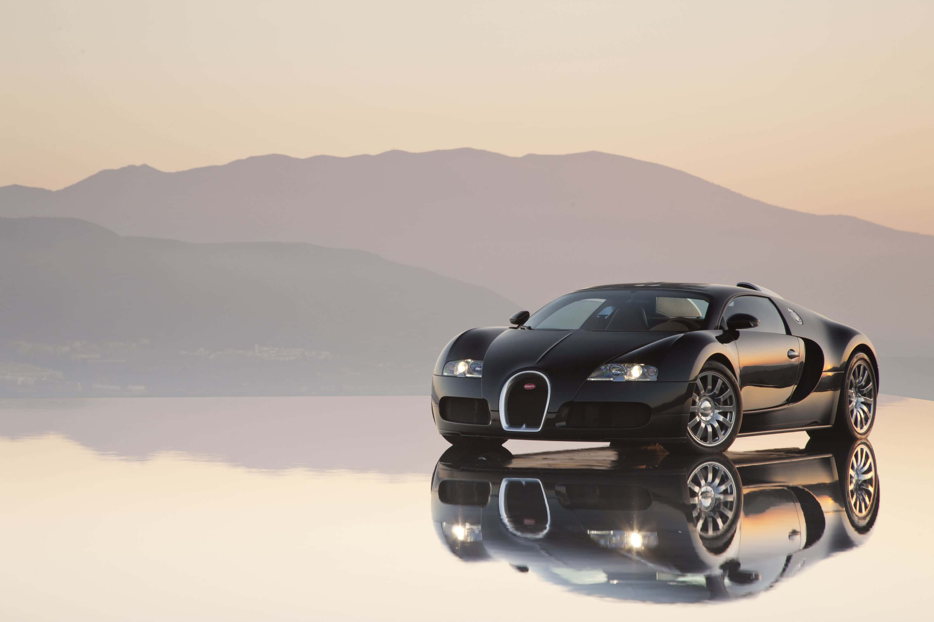 Bugatti Veyron, sleek black, reflective surface, 2K Desktop Wallpaper