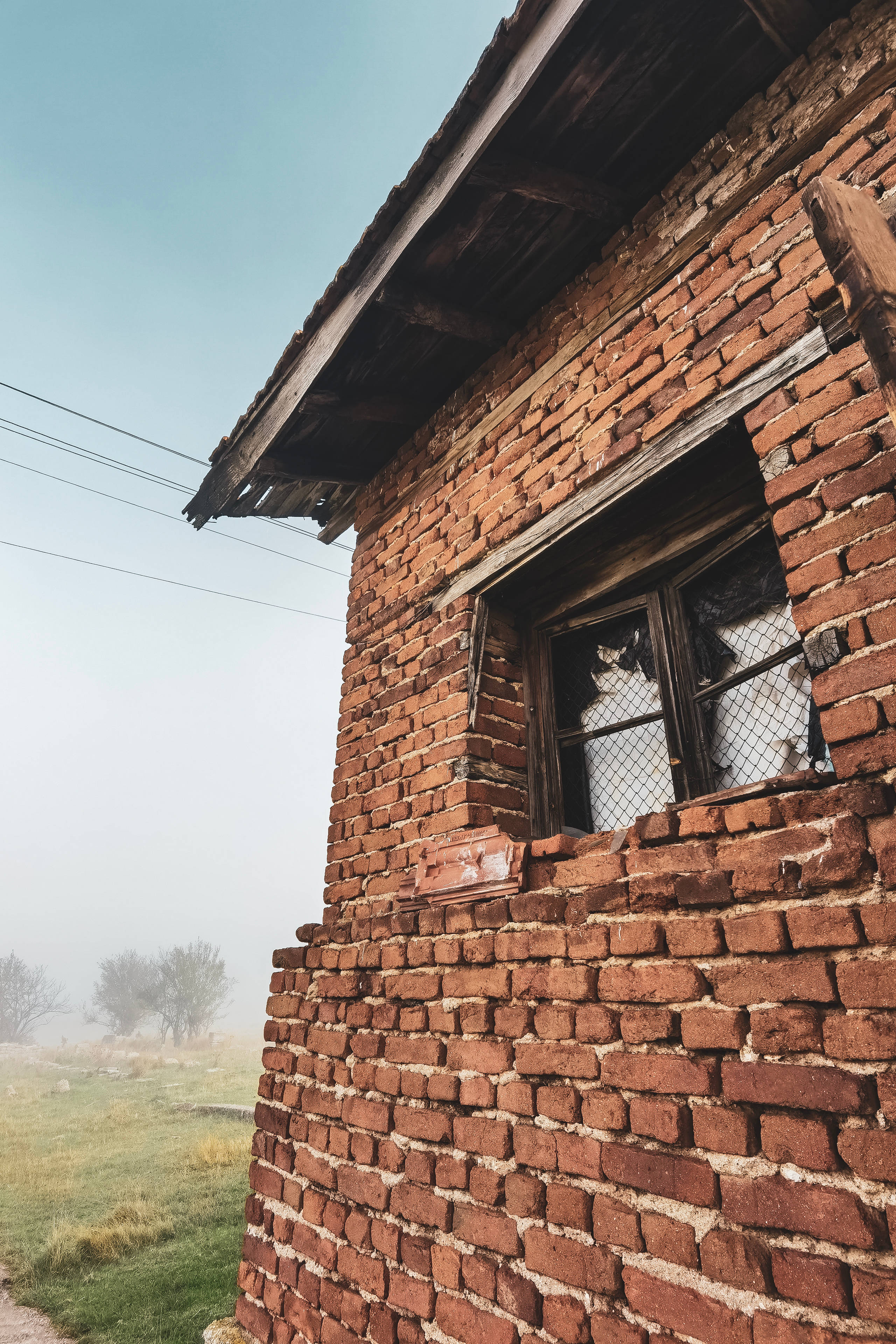 Bulgarian brick house, weathered brick building, broken window, 4K Phone Wallpaper