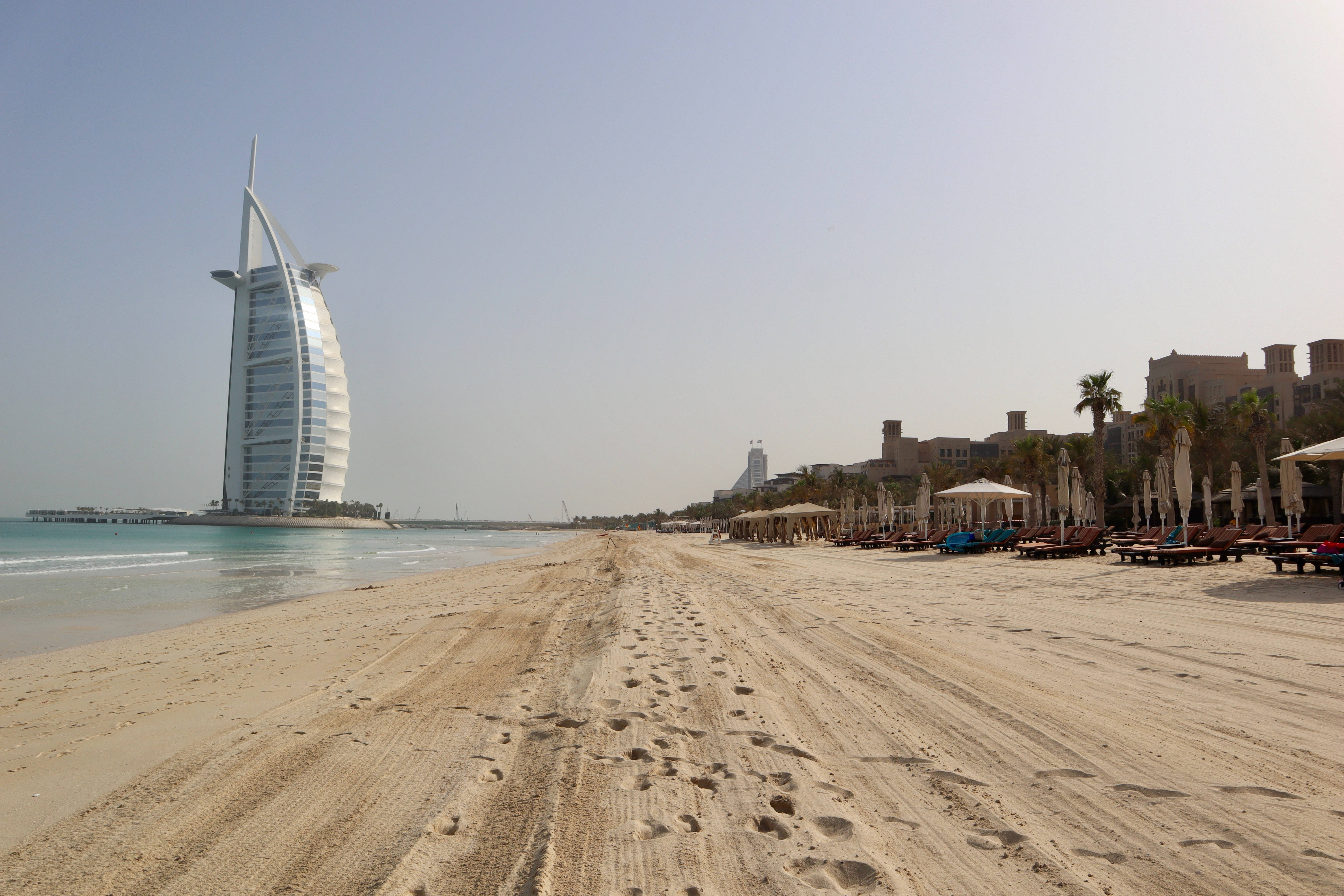 Burj Al Arab, sandy beach path, hazy sky, 5K Desktop Wallpaper