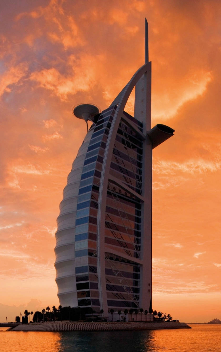 Burj Al Arab, sail-shaped hotel, fiery orange sunset sky, HD Phone Wallpaper