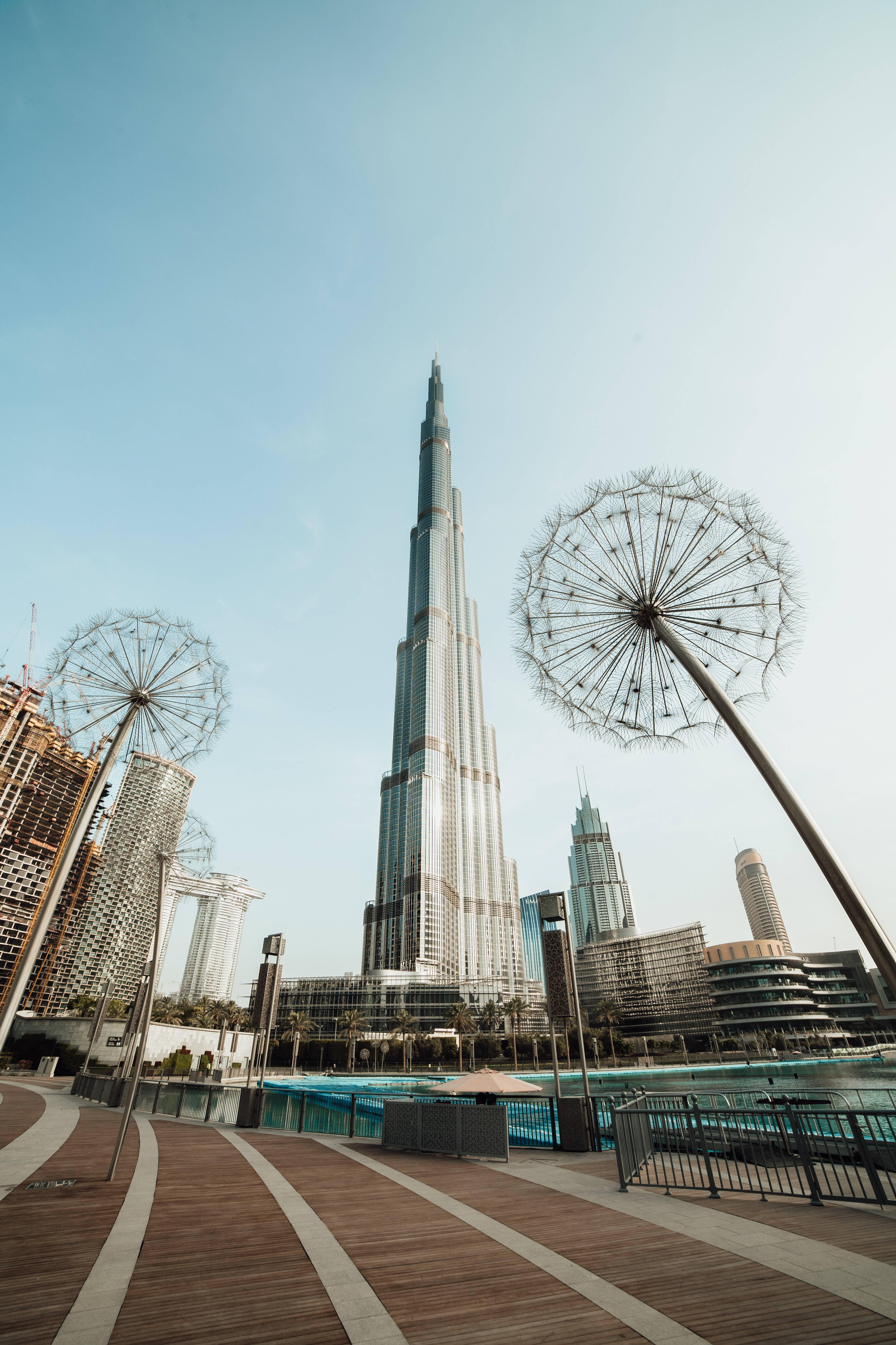 Burj Khalifa, dandelion sculptures, wooden walkway, 5K Phone Wallpaper