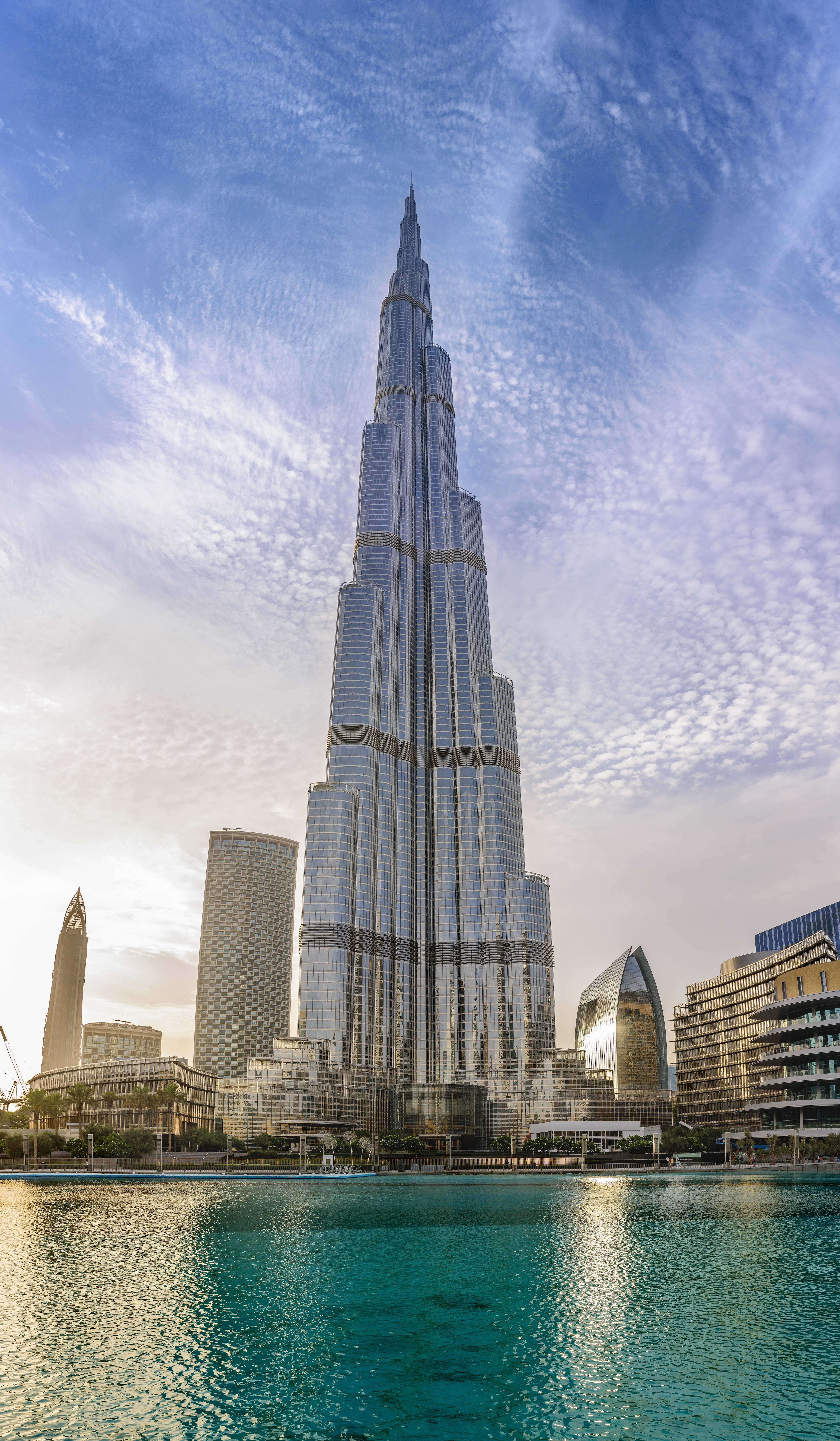 Burj Khalifa, reflective pool, bright blue sky, 8K Phone Wallpaper