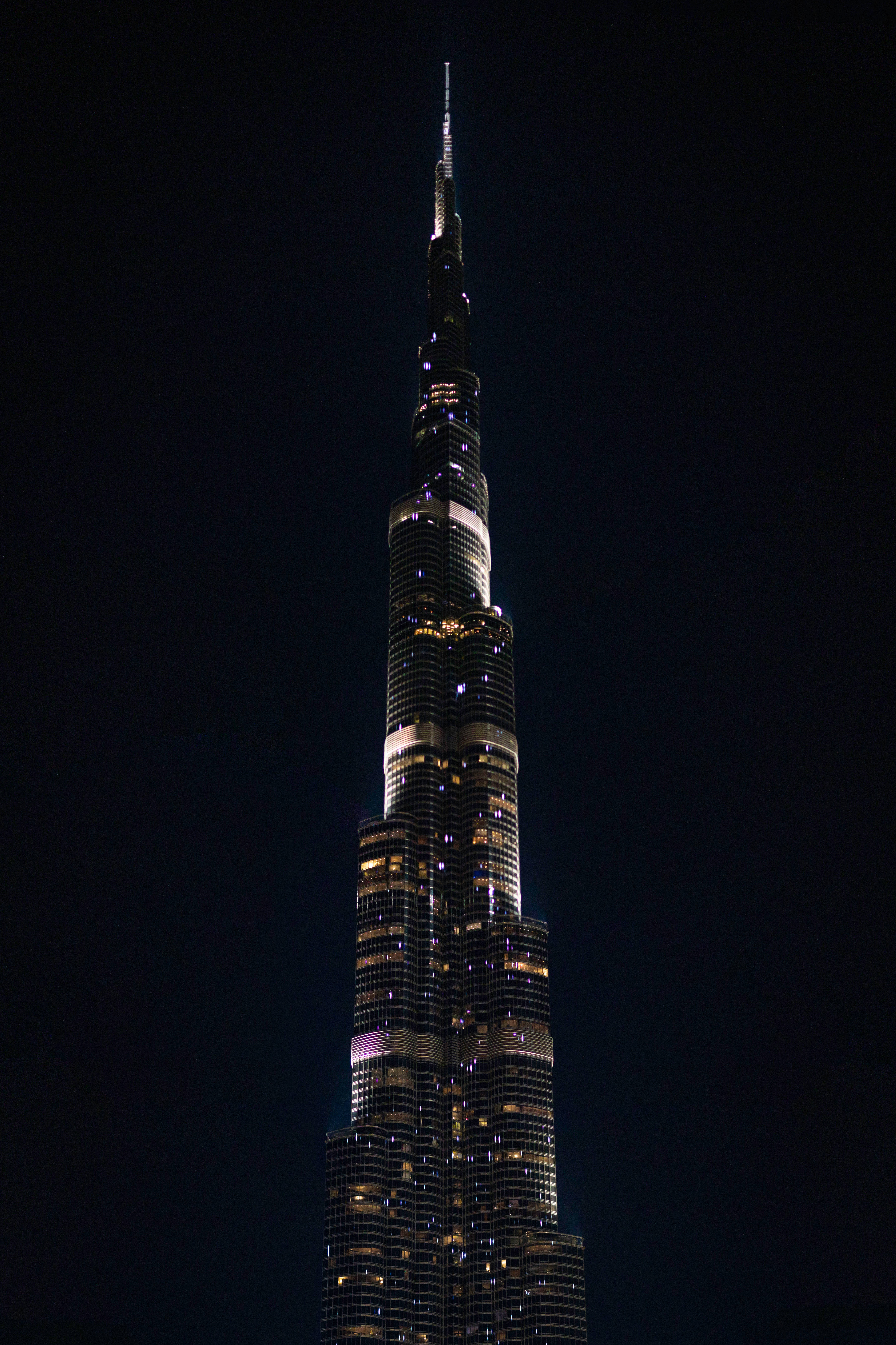 Burj Khalifa, glowing windows, sharp spire, 8K Phone Wallpaper