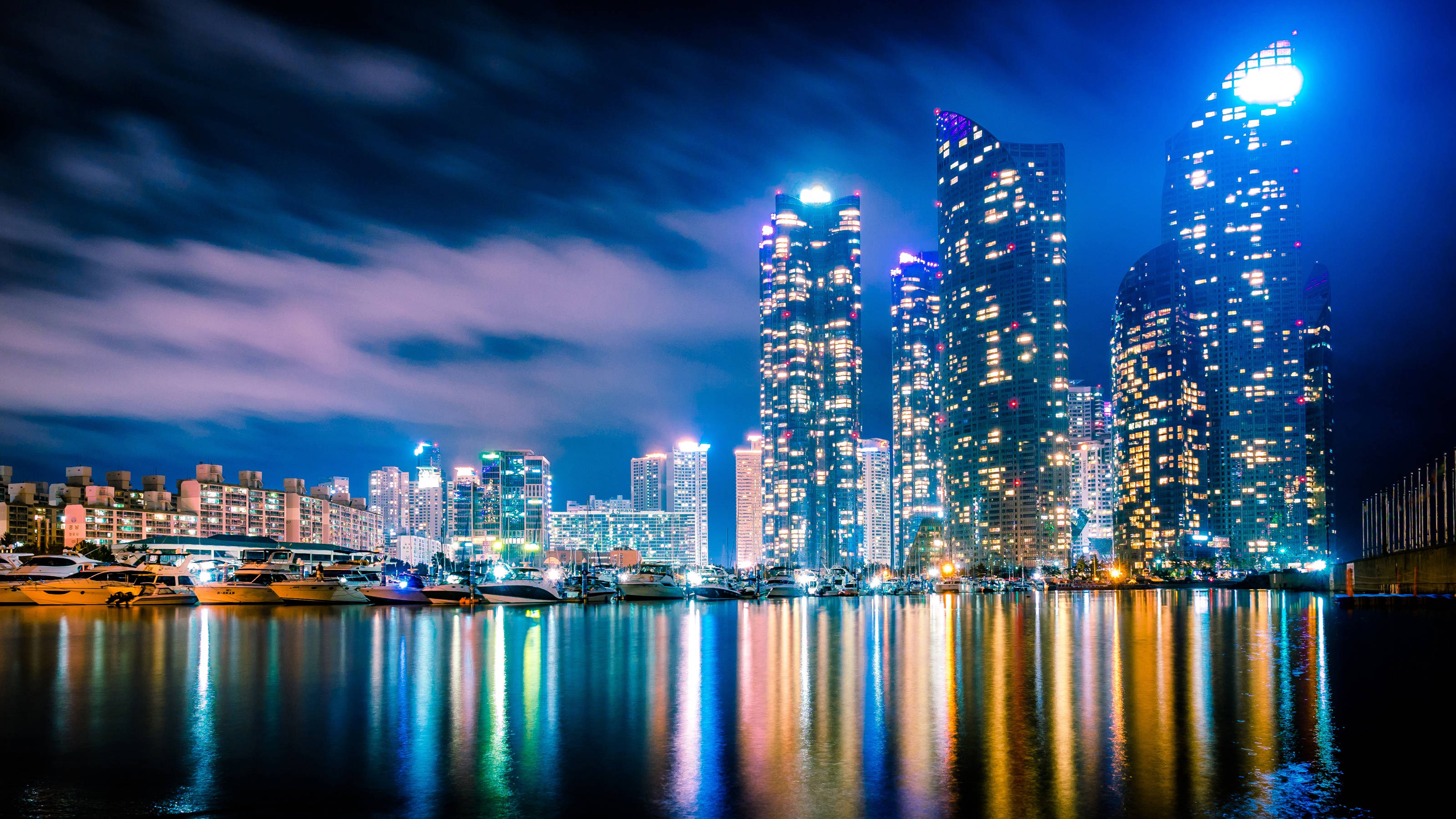 Busan, nighttime cityscape, towering skyscrapers, 2K Desktop Wallpaper