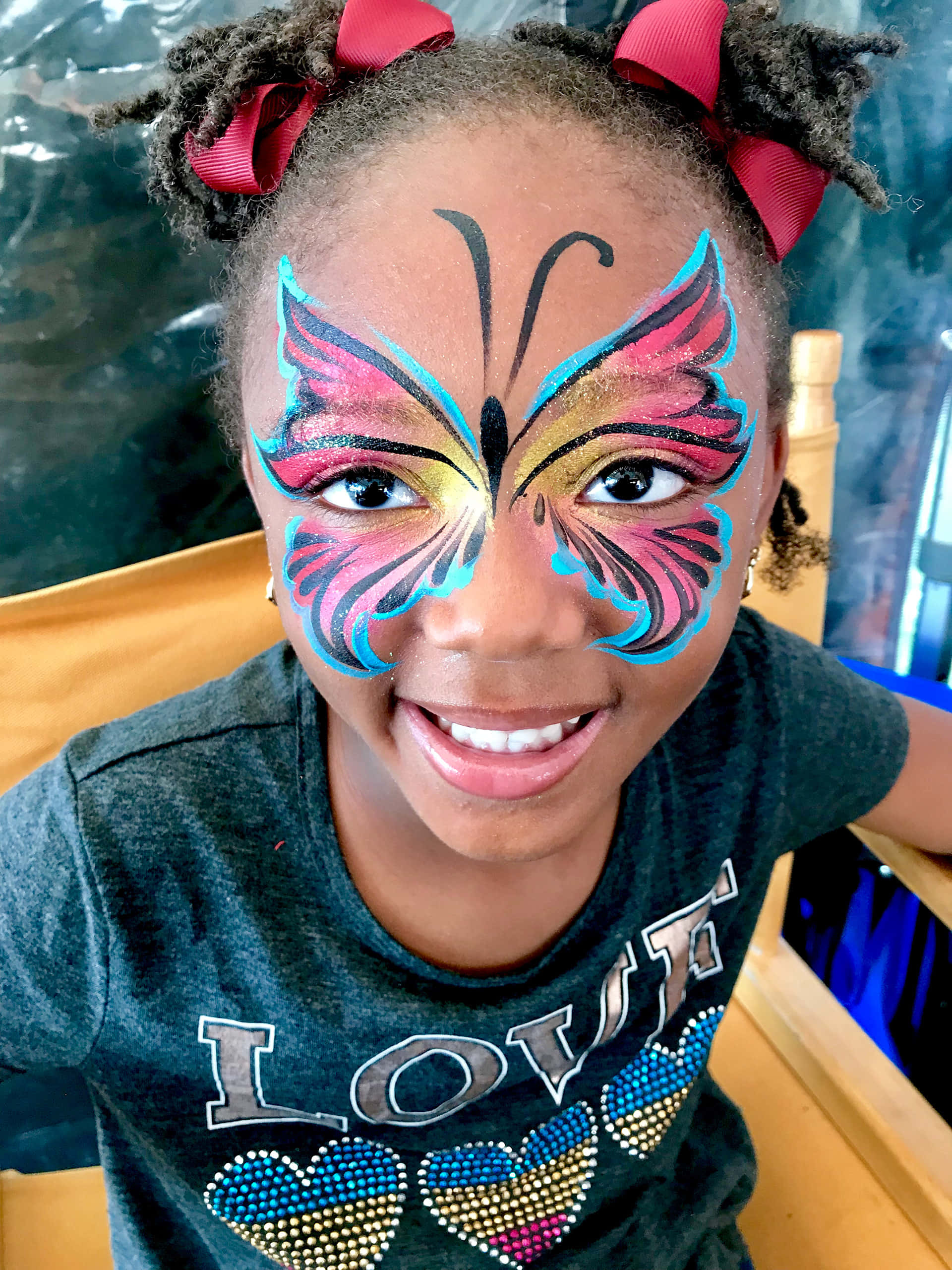butterfly face paint, red bows, joyful child, 2K Phone Wallpaper