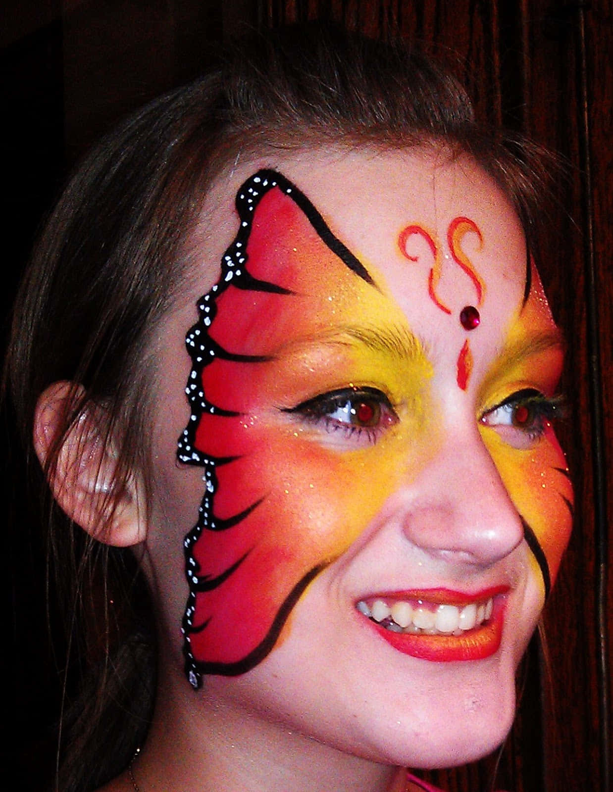 butterfly face paint, red yellow and black, dark wooden background, HD Phone Wallpaper