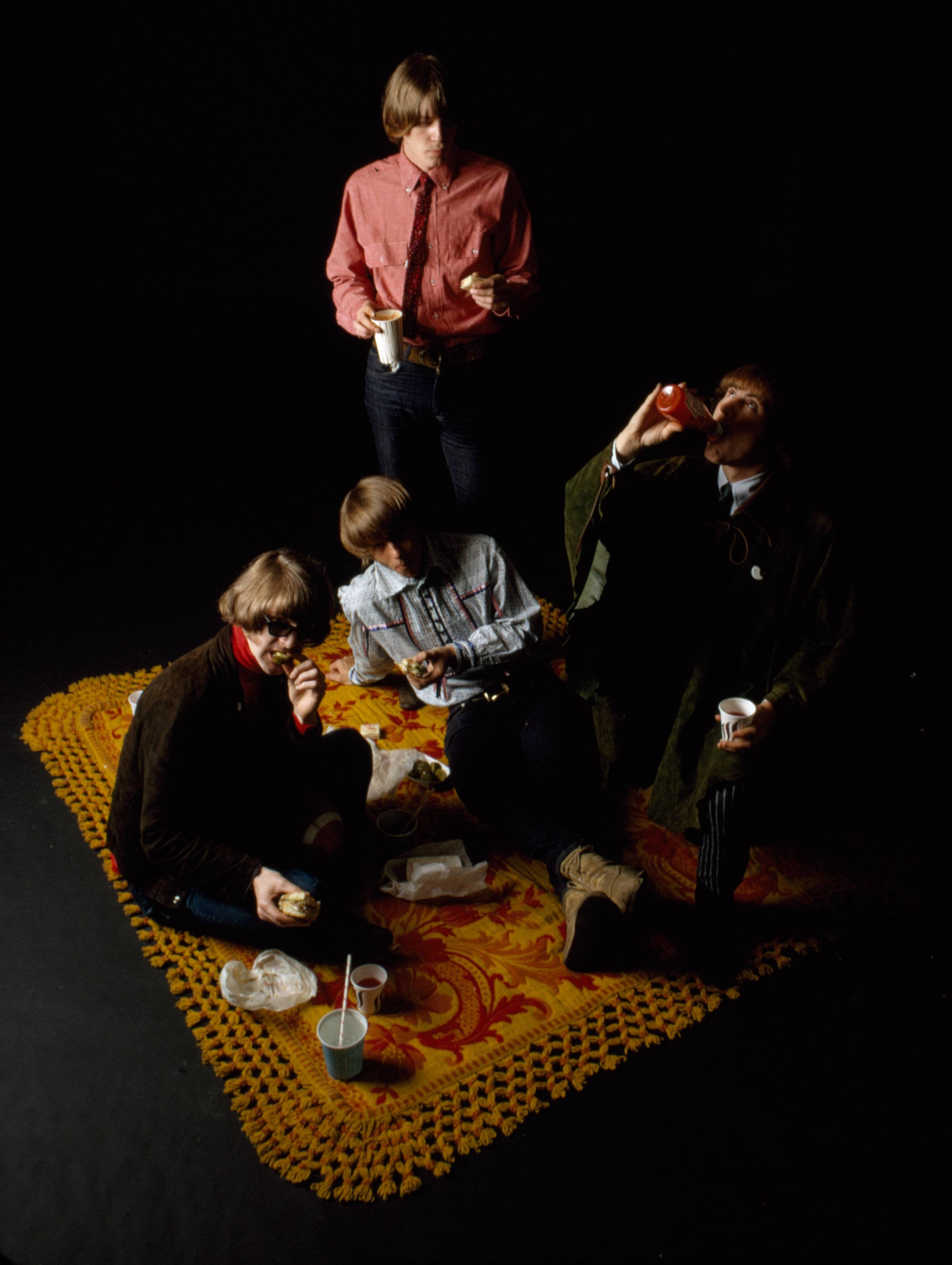 The Byrds, 1970s attire, vibrant yellow patterned rug, 2K Phone Wallpaper