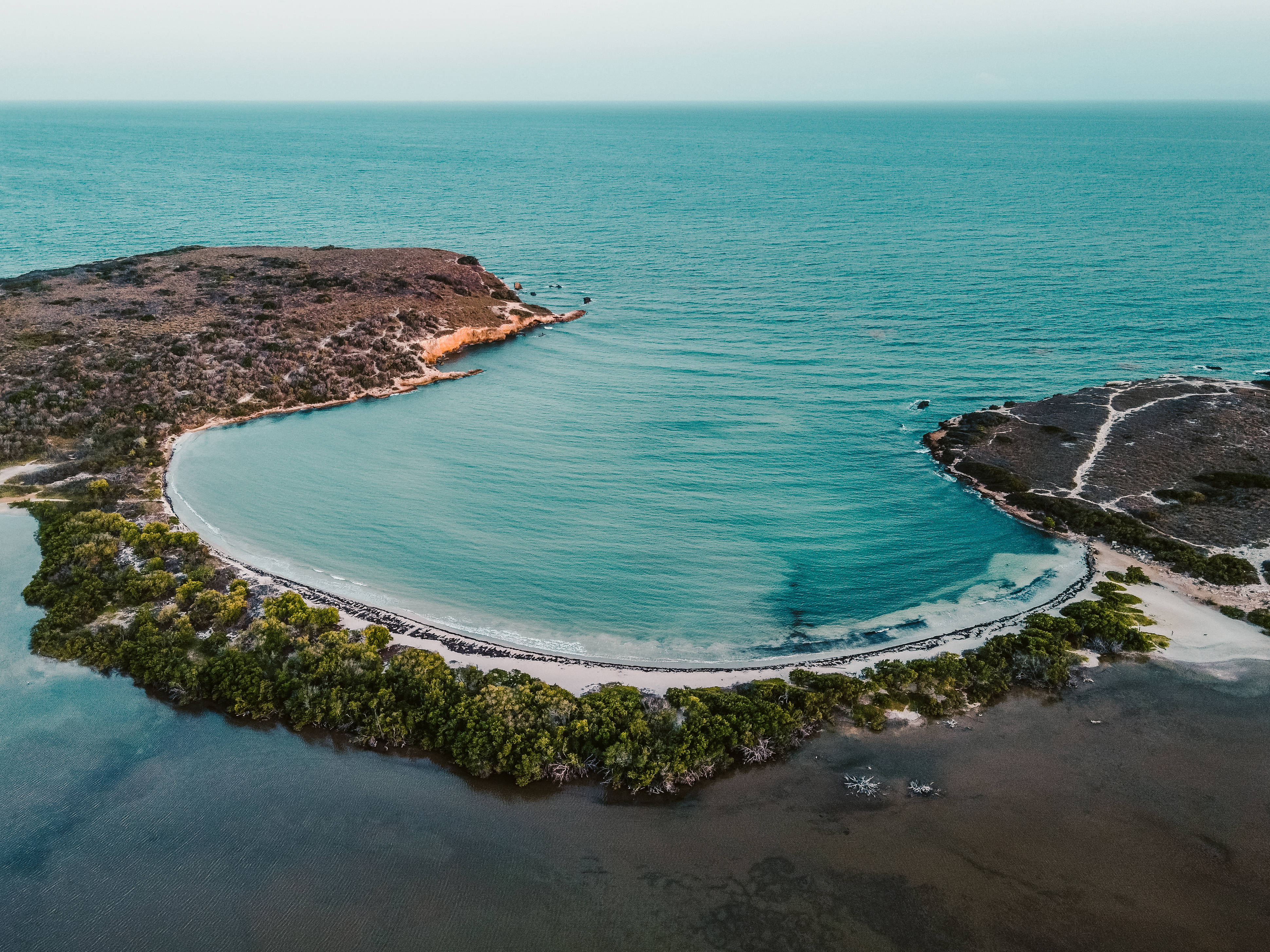 Cabo Verde, crescent-shaped turquoise bay, rugged cliffs, 4K Desktop Wallpaper
