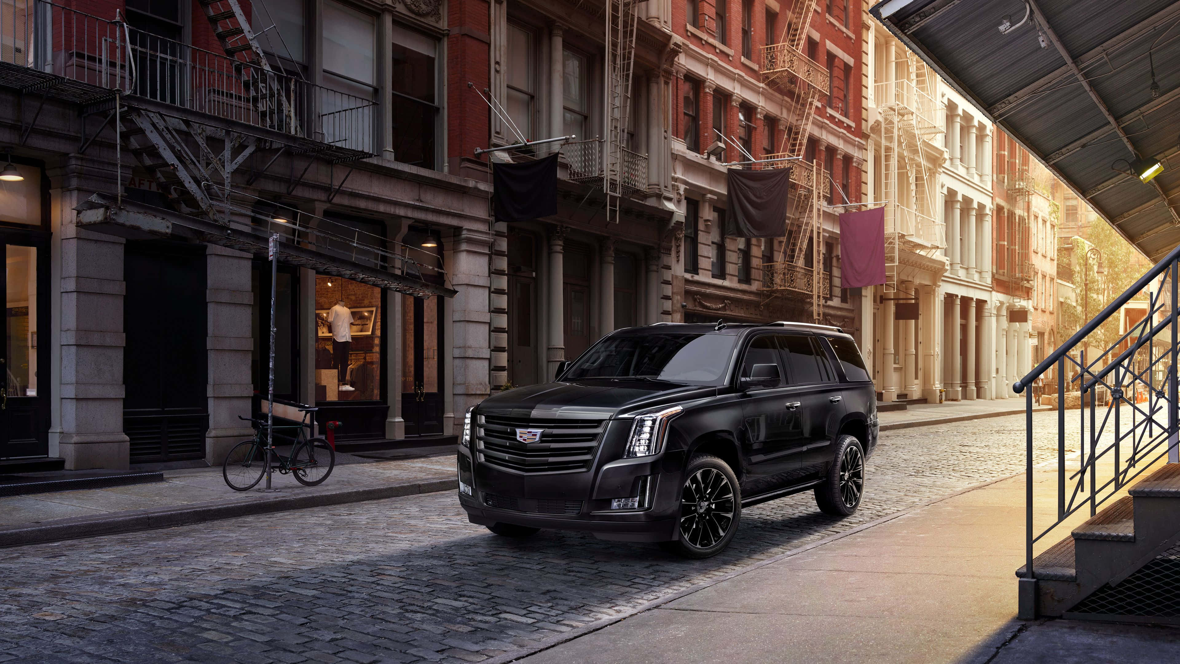 Cadillac Escalade, black, sunlit cobblestone street, 4K Desktop Wallpaper