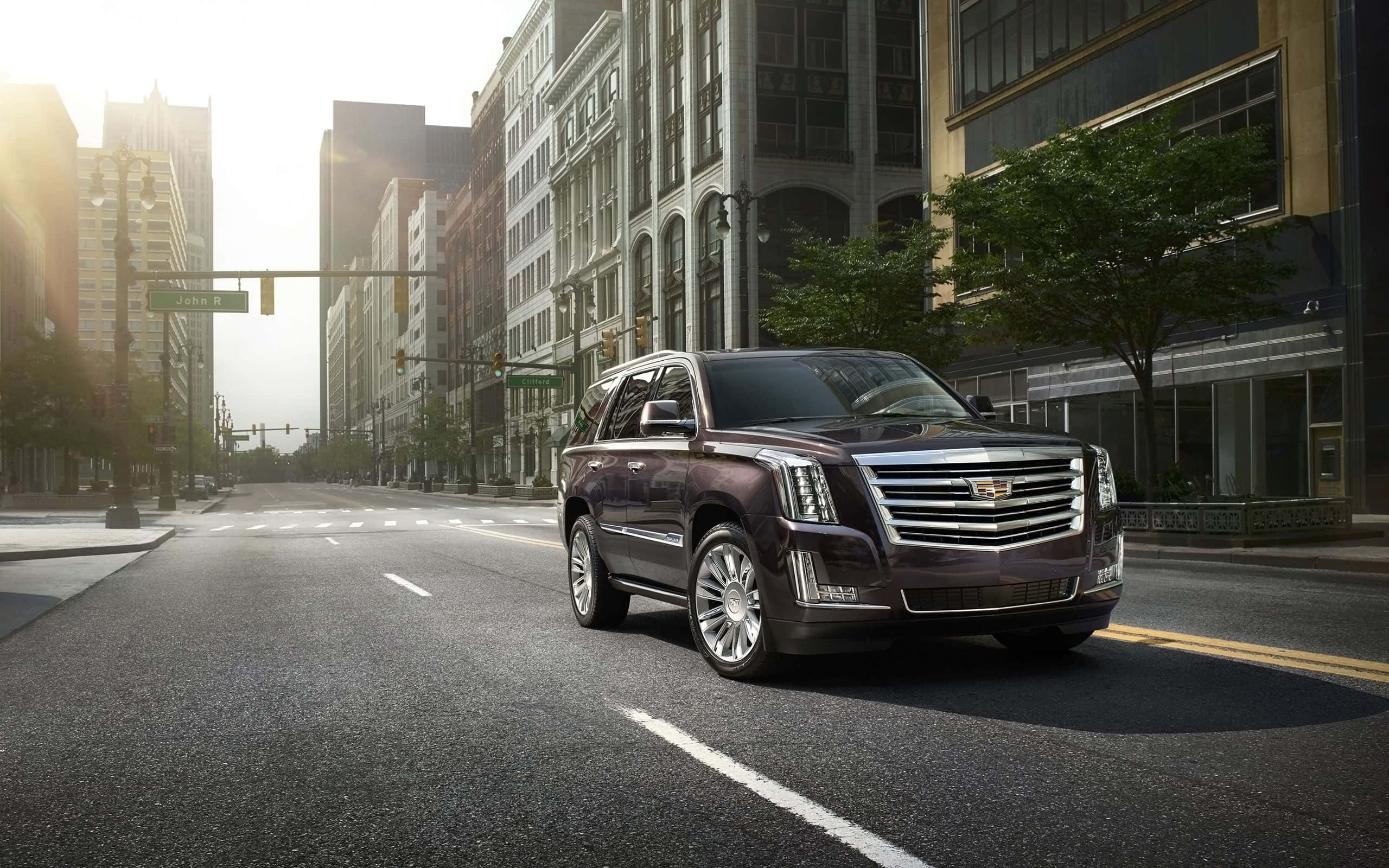 Cadillac Escalade, maroon, sunlit urban street, 2K Desktop Wallpaper