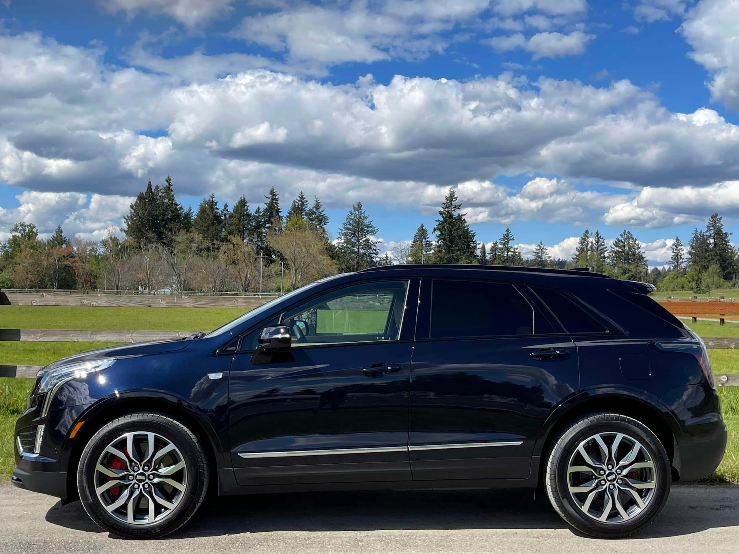Cadillac XT5, dark blue, bright blue sky, 2K Desktop Wallpaper
