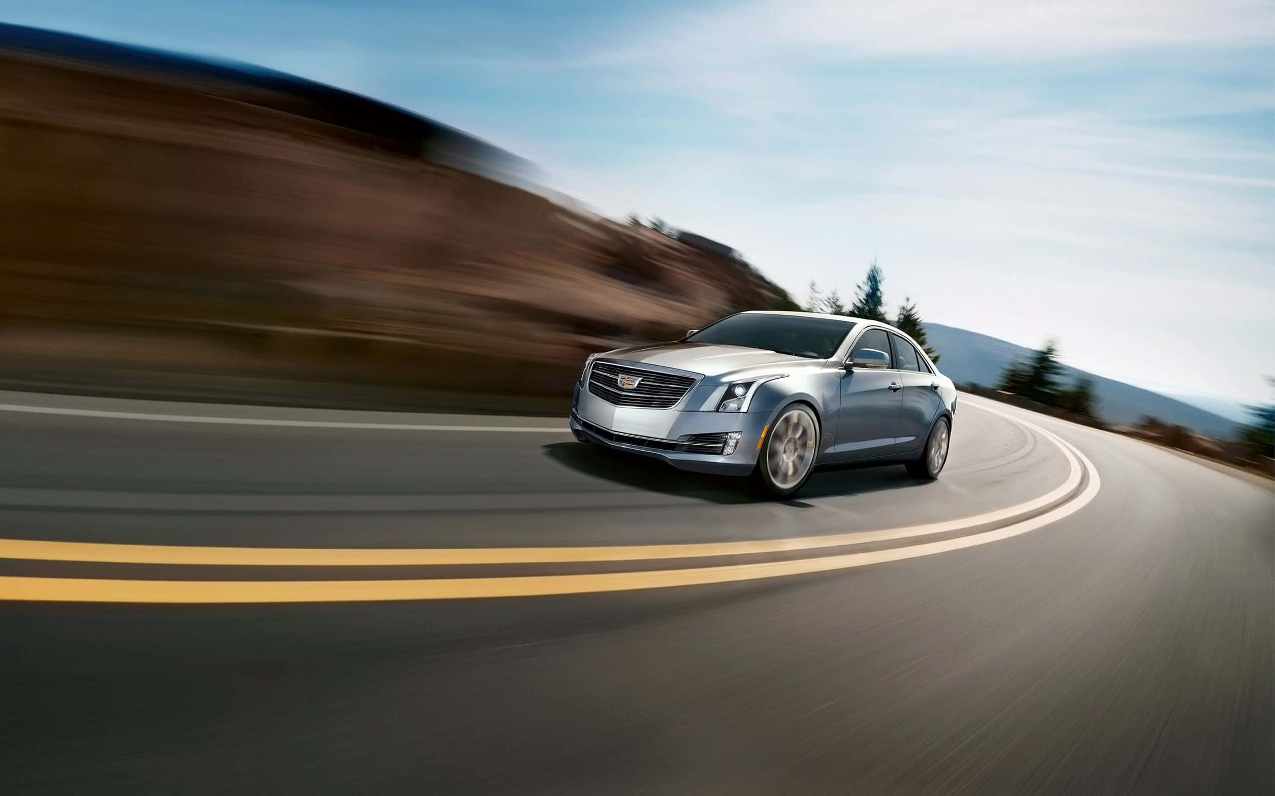 Cadillac XTS, silver, curving mountain road, 2K Desktop Wallpaper