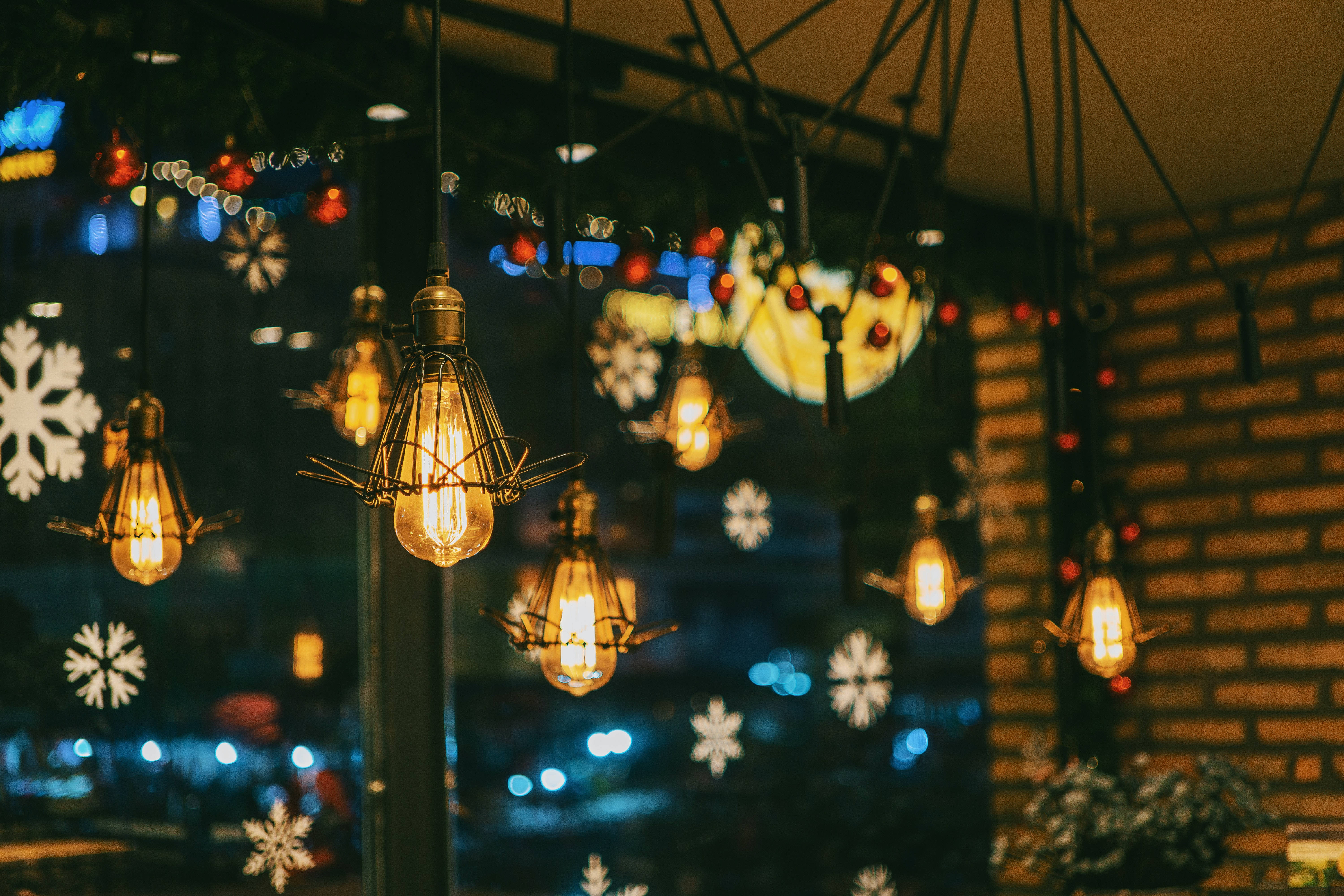 Edison bulbs, cozy cafe, snowflake decals, 5K Desktop Wallpaper