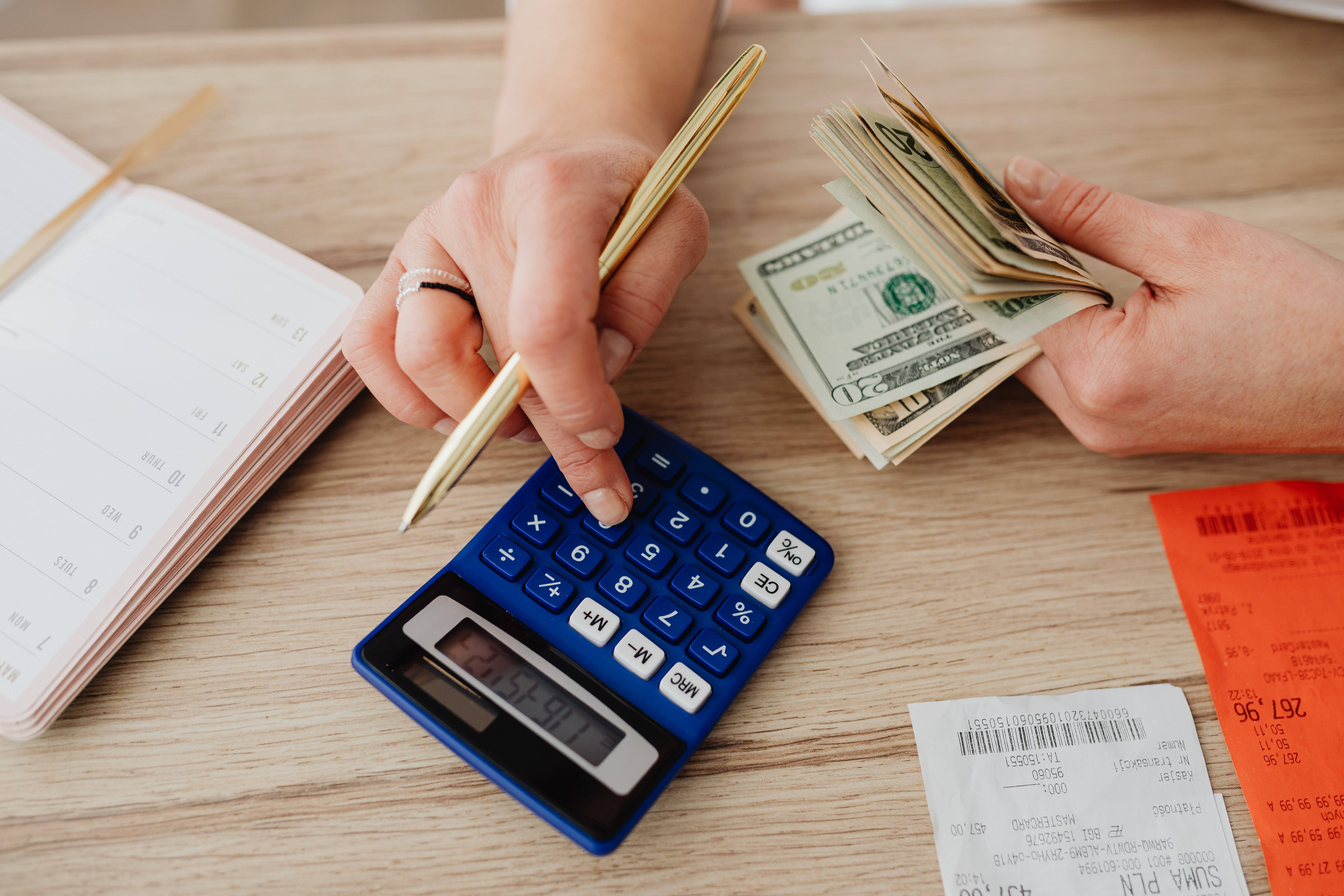 blue calculator, wooden desk, receipts, 5K Desktop Wallpaper
