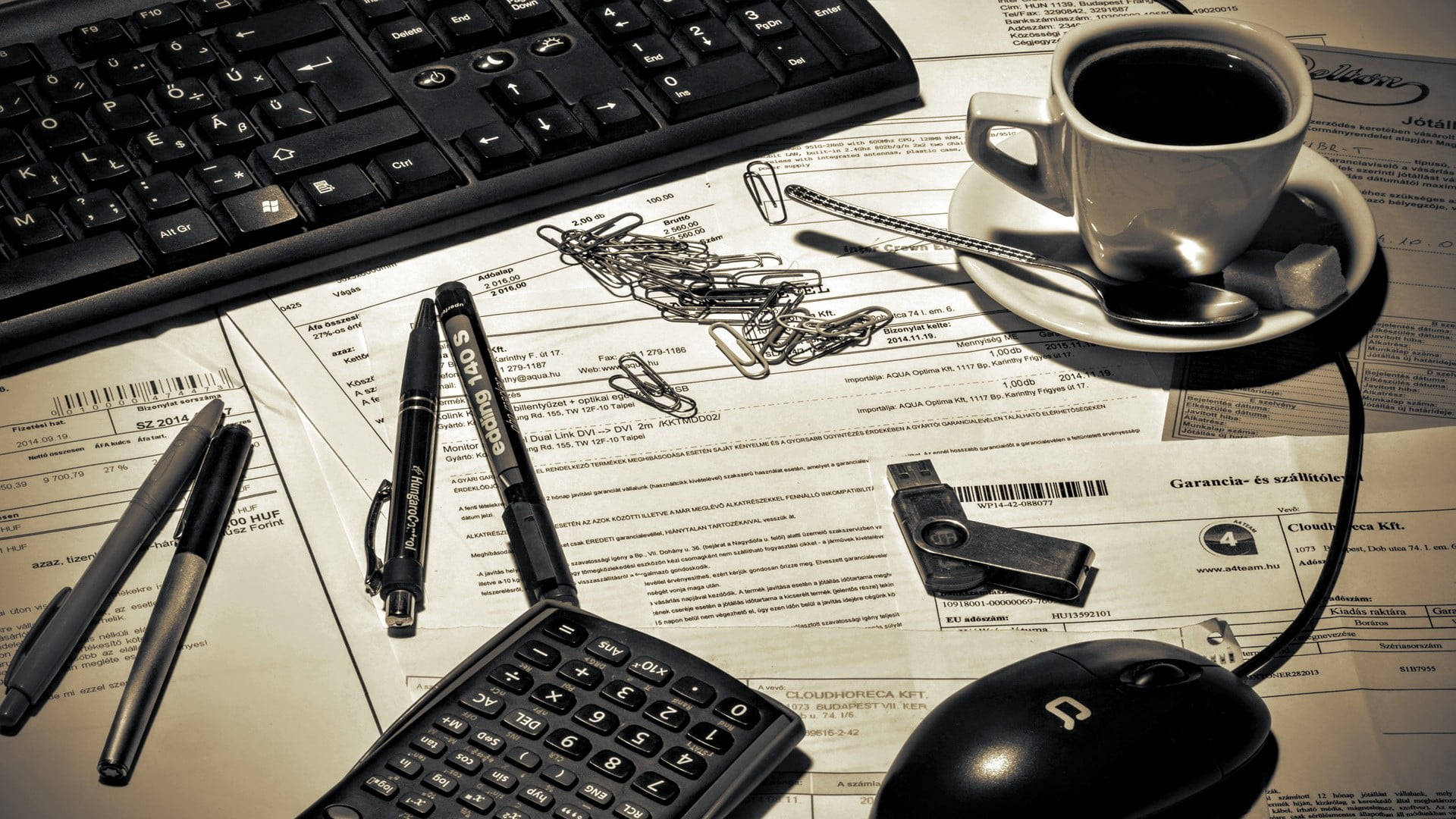 keyboard calculator, messy office table, warm lighting, Full HD Desktop Wallpaper