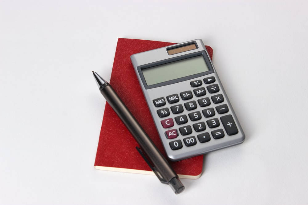 silver calculator, black pen, textured red notebook, SD Desktop Wallpaper