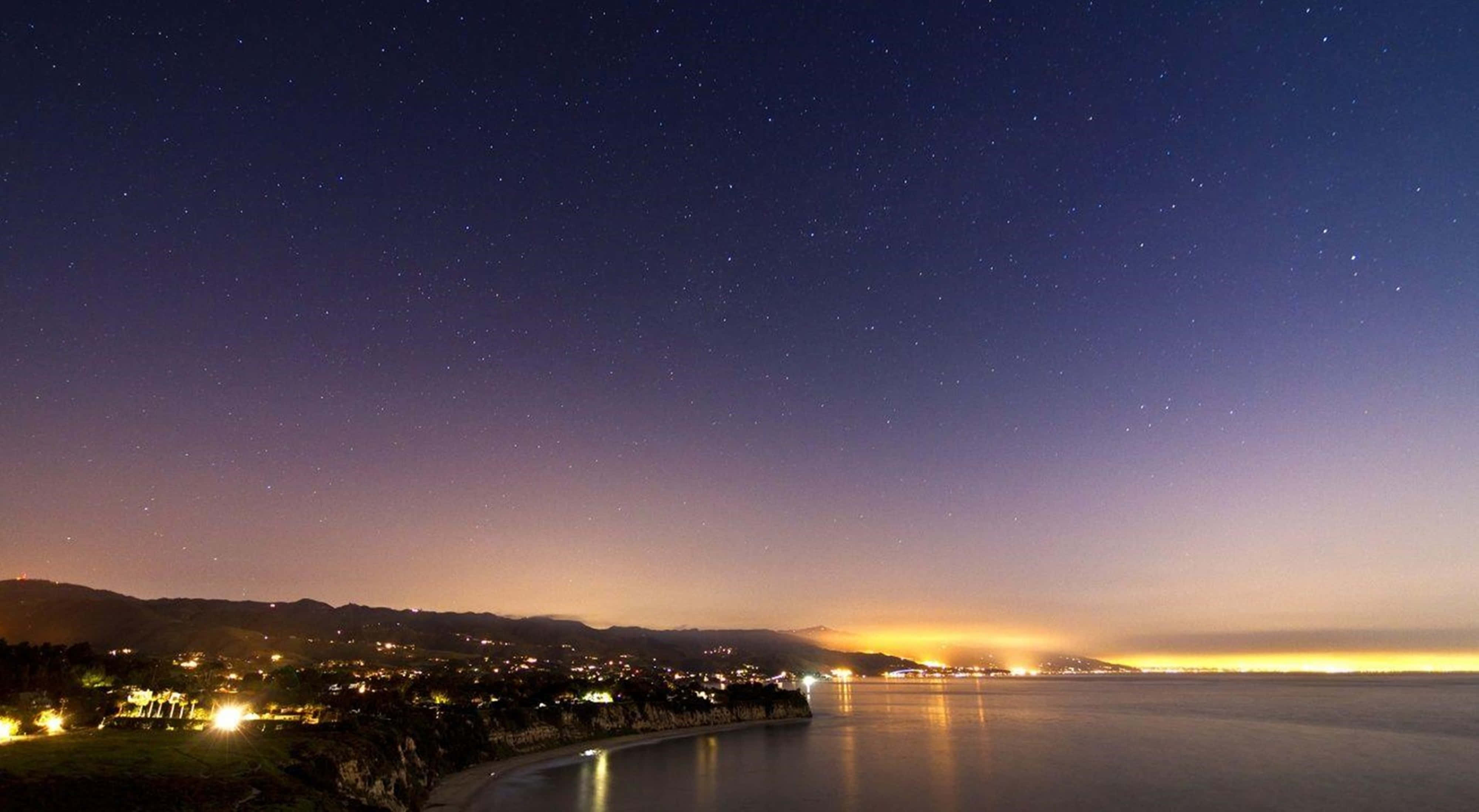 California, starry night sky, coastal town, 4K Desktop Wallpaper