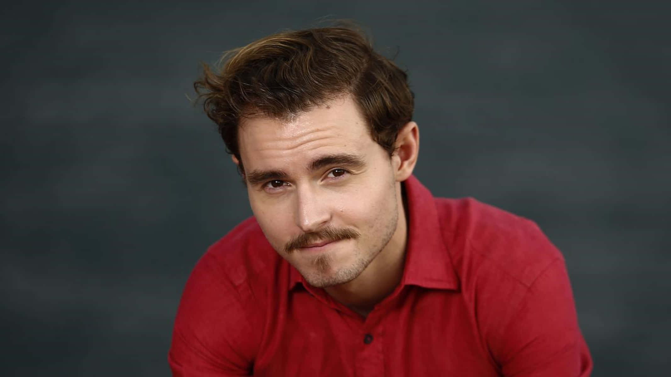 Callan Mcauliffe, red shirt, tousled brown hair, Full HD Desktop Wallpaper