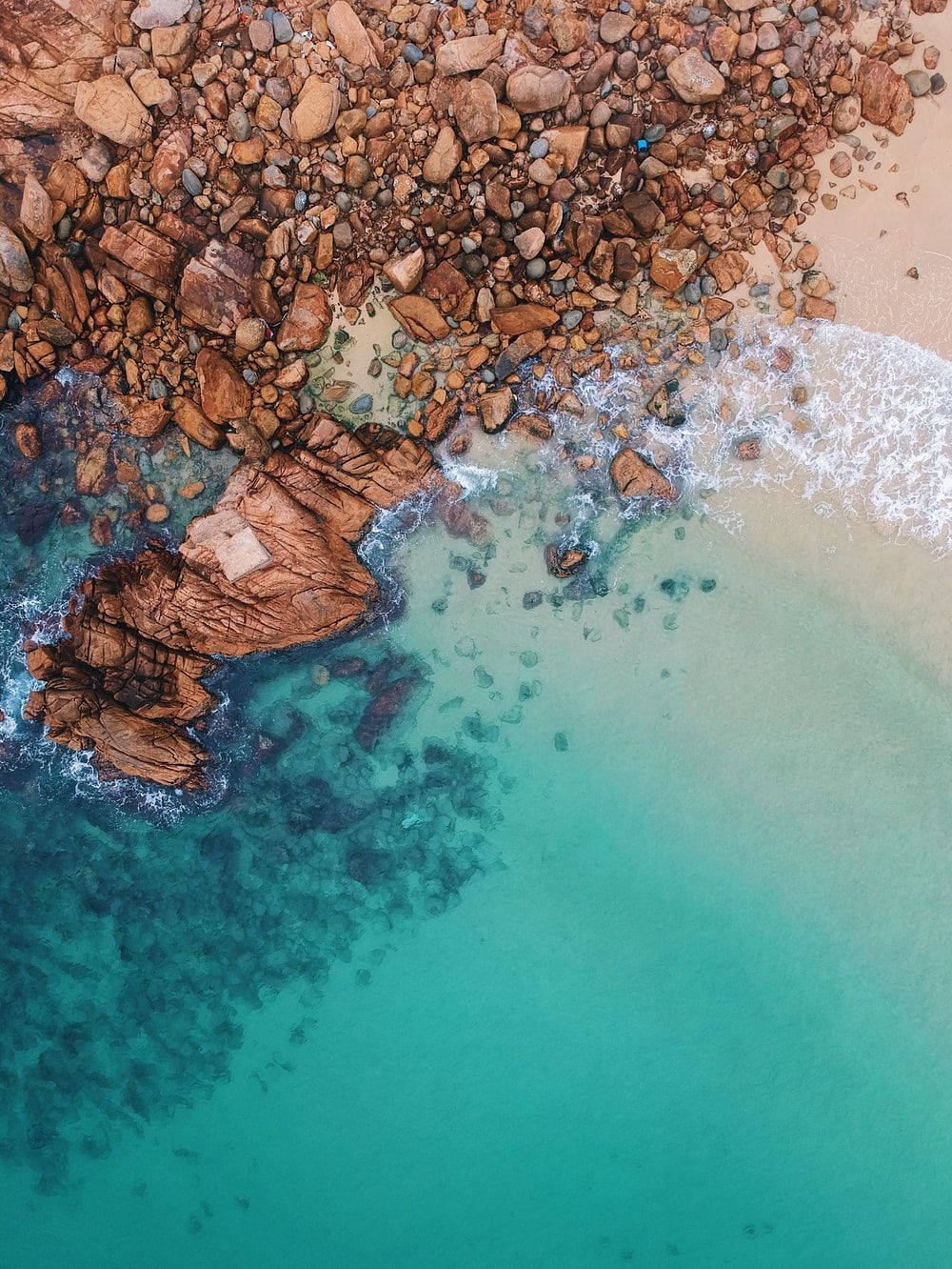 turquoise waters, rocky shore, scattered boulders, HD Phone Wallpaper
