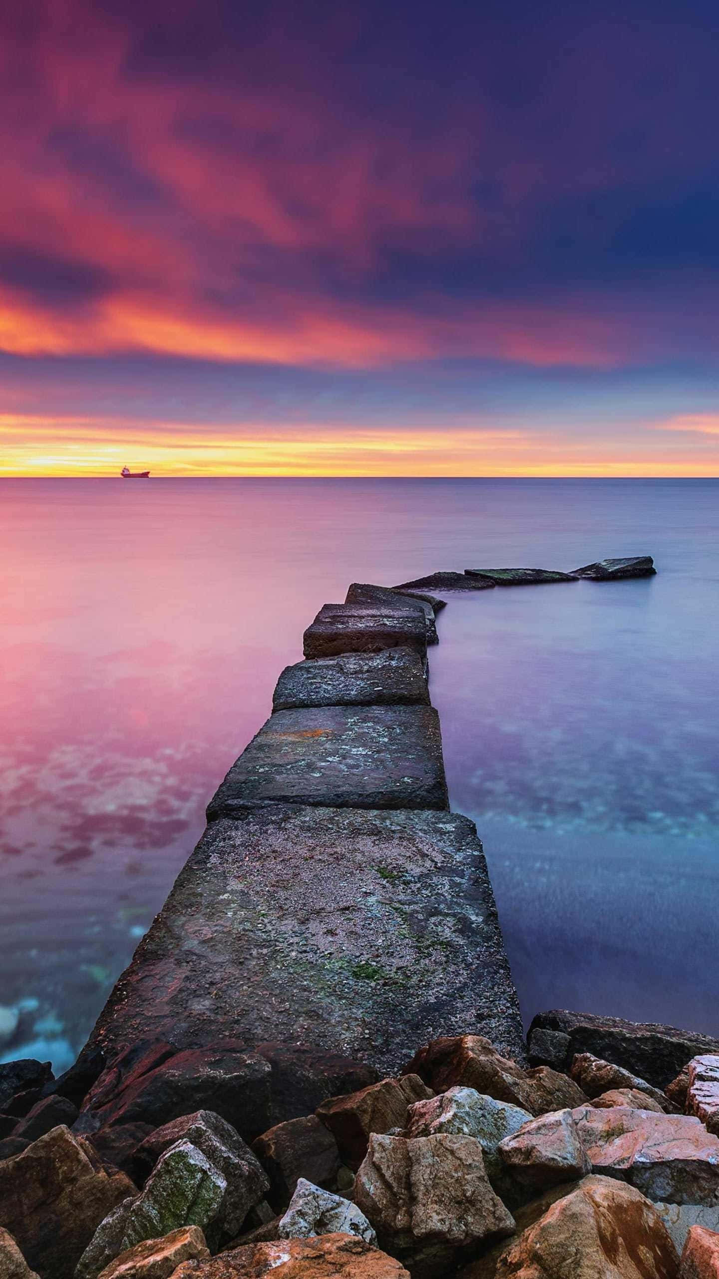 Calming iPhone Sea Sky, pink purple and orange sunset sky, long stone jetty, 2K Phone Wallpaper