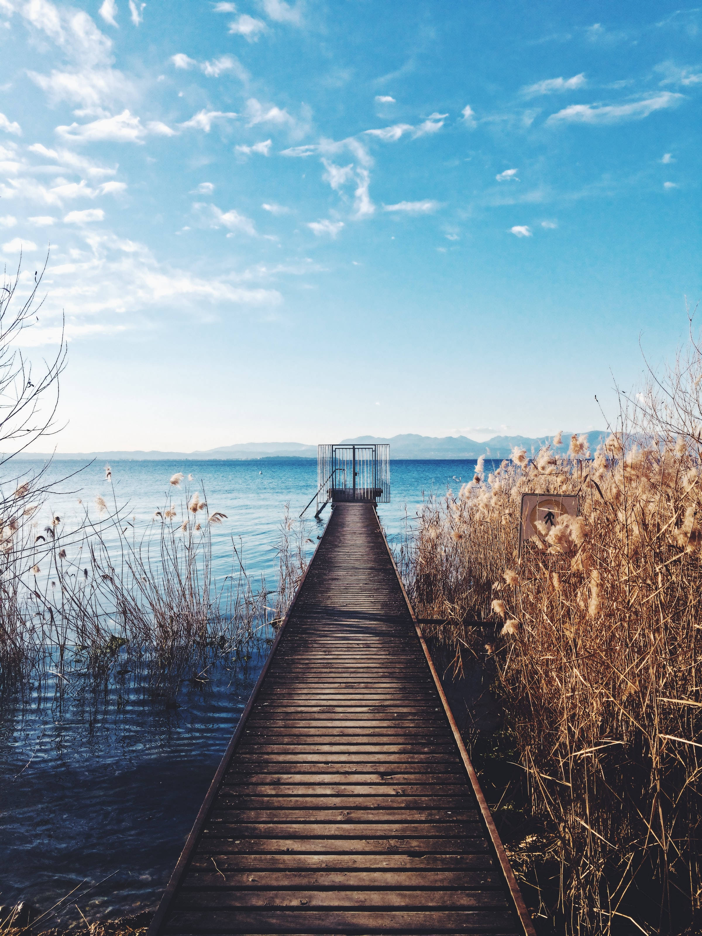 calm blue lake, wooden pier, bright sky, 2K Phone Wallpaper