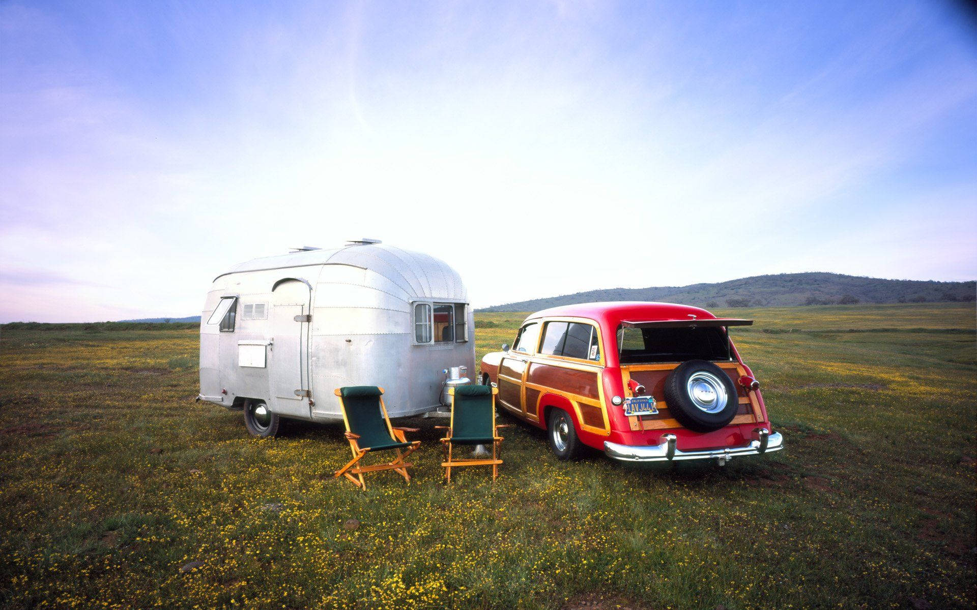 vintage red wood panel station wagon, silver Airstream trailer, sunlit field of yellow wildflowers, Full HD Desktop Wallpaper