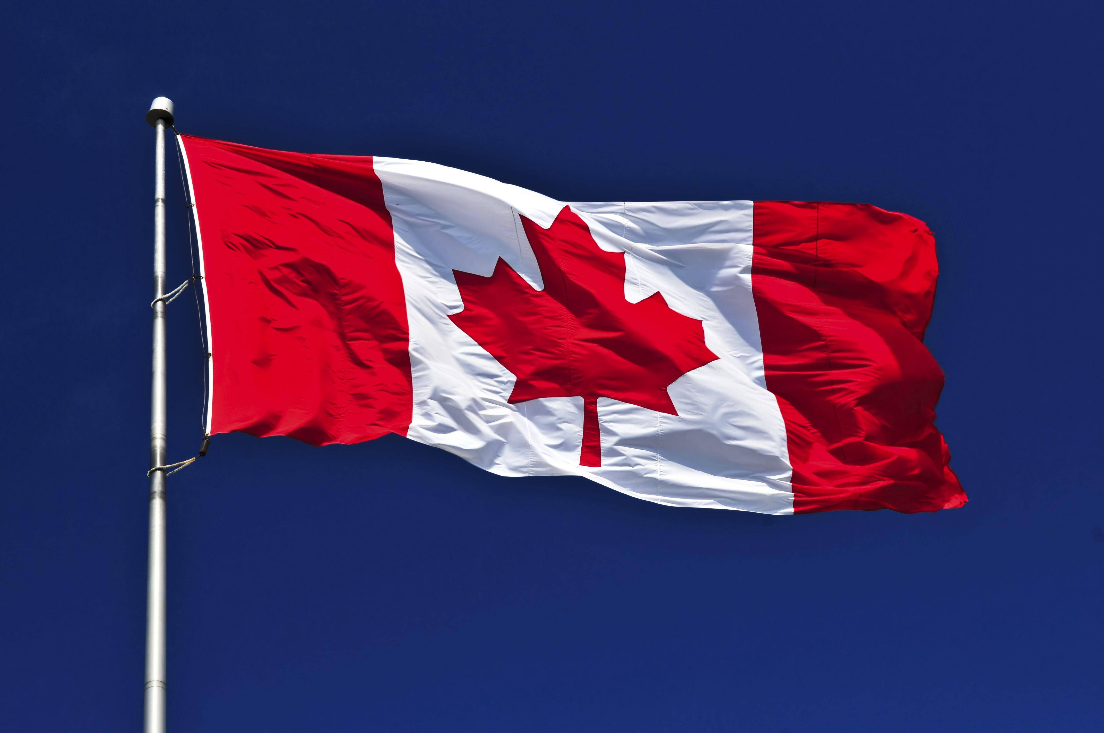 Canada flag, red maple leaf, deep blue sky, 4K Desktop Wallpaper