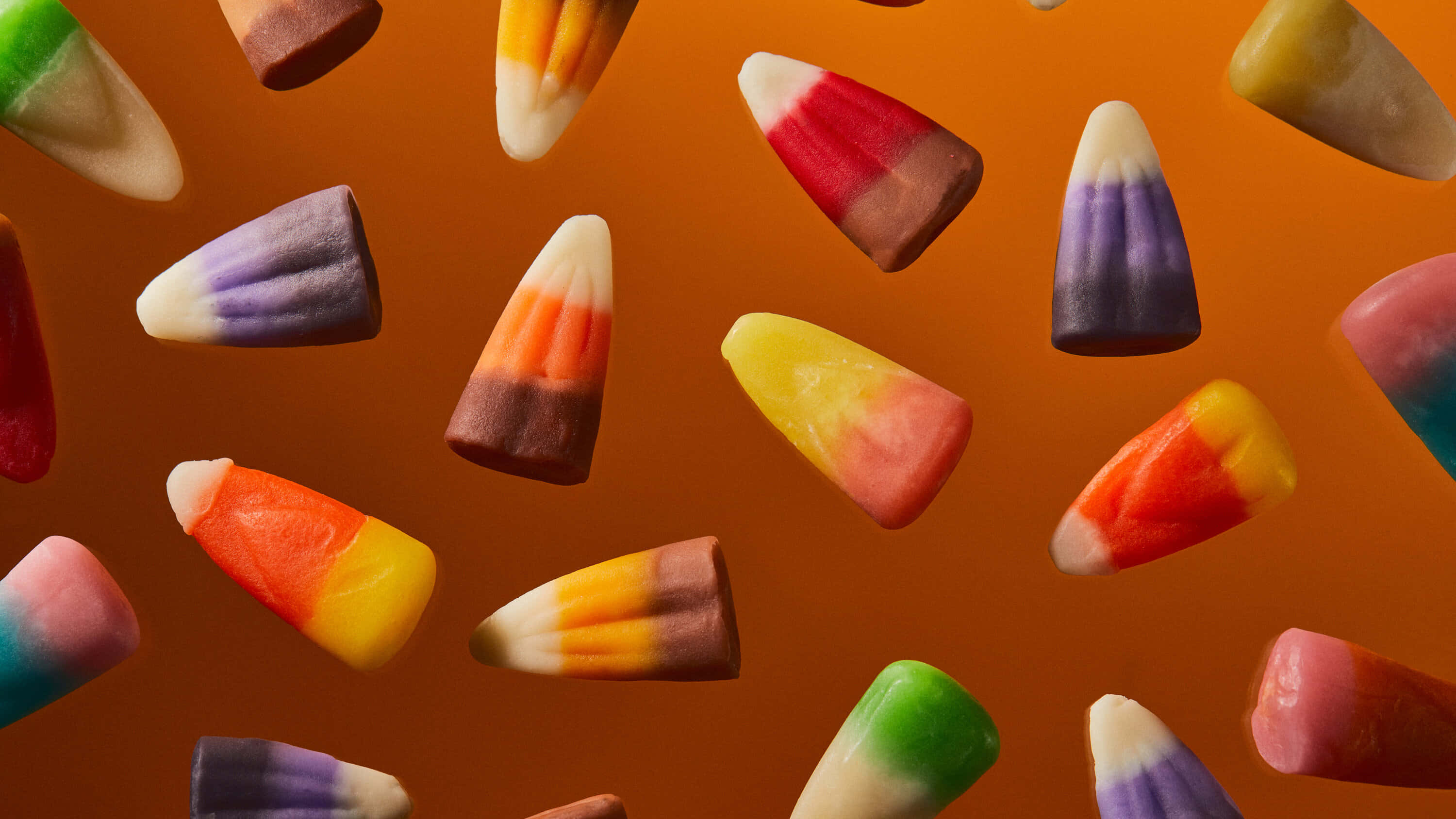 Candy Corn, vibrant, warm orange backdrop, 2K Desktop Wallpaper