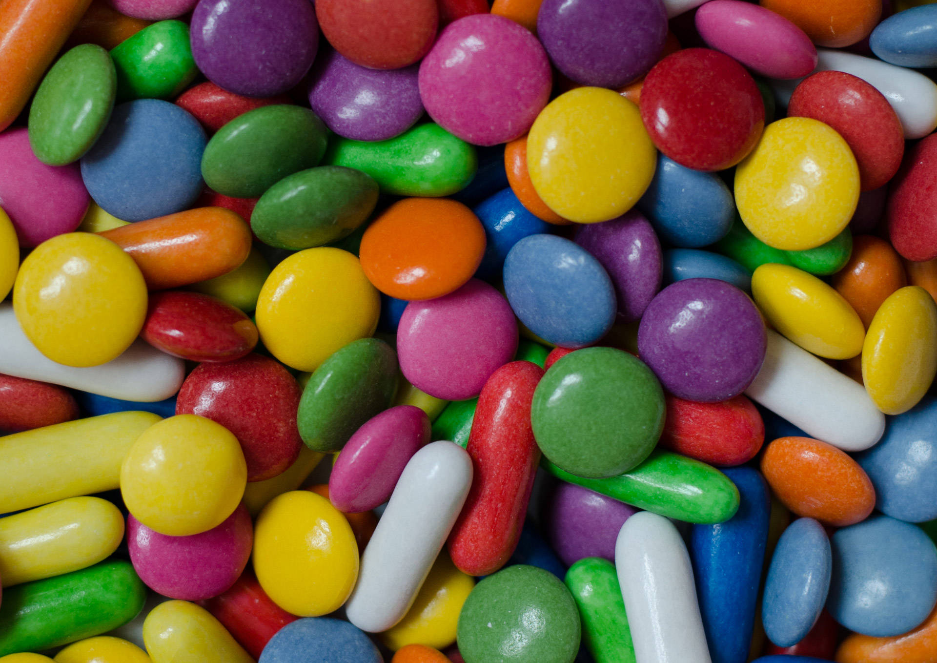 colorful coated candies, glossy surfaces, varied shapes, Full HD Desktop Wallpaper