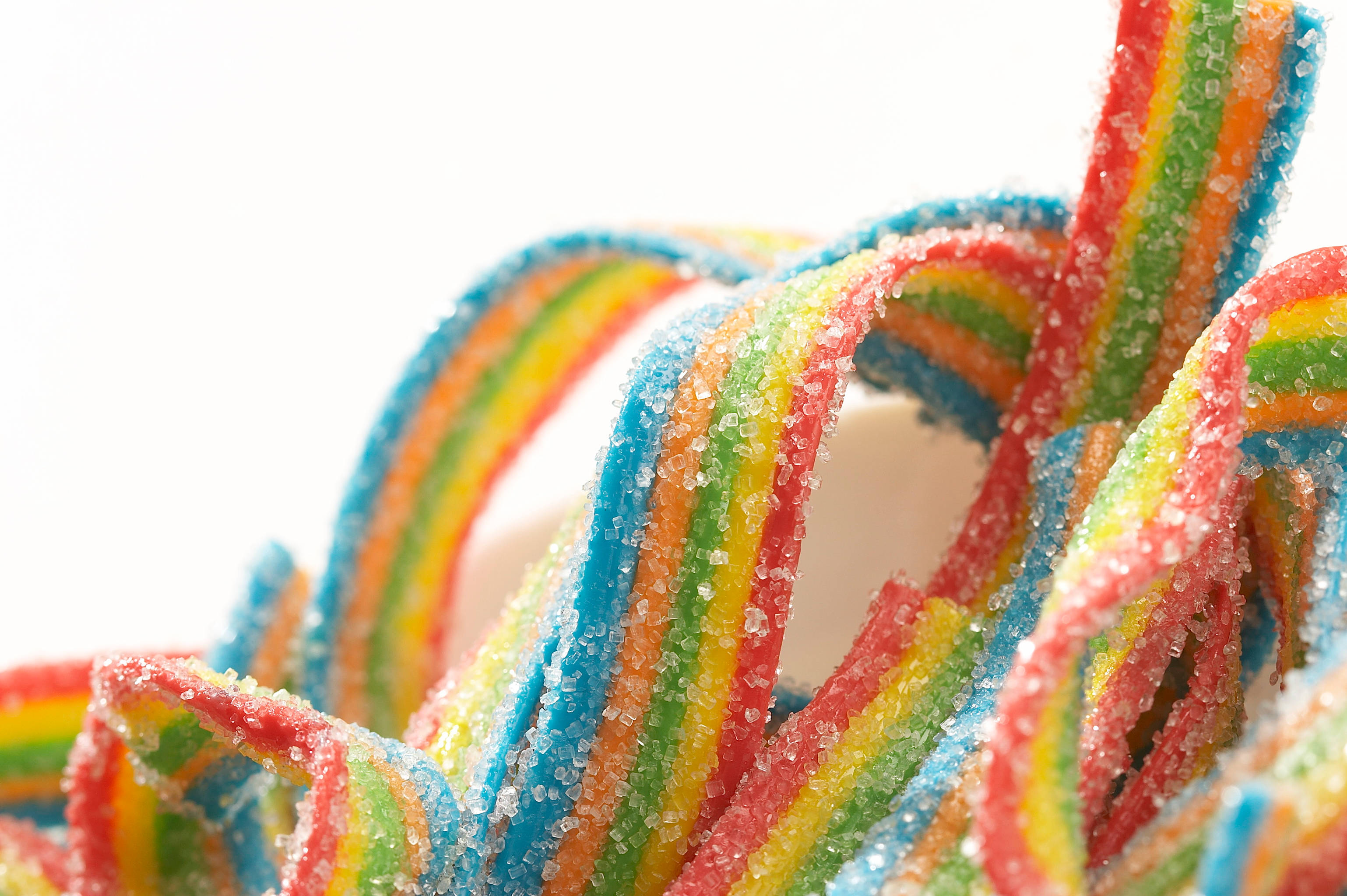 rainbow belt gummy candies, vibrant rainbow, sparkling sugar, 2K Desktop Wallpaper