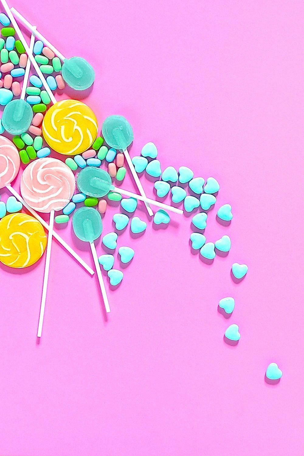 pastel aesthetic, vibrant pink background, colorful lollipops, HD Phone Wallpaper