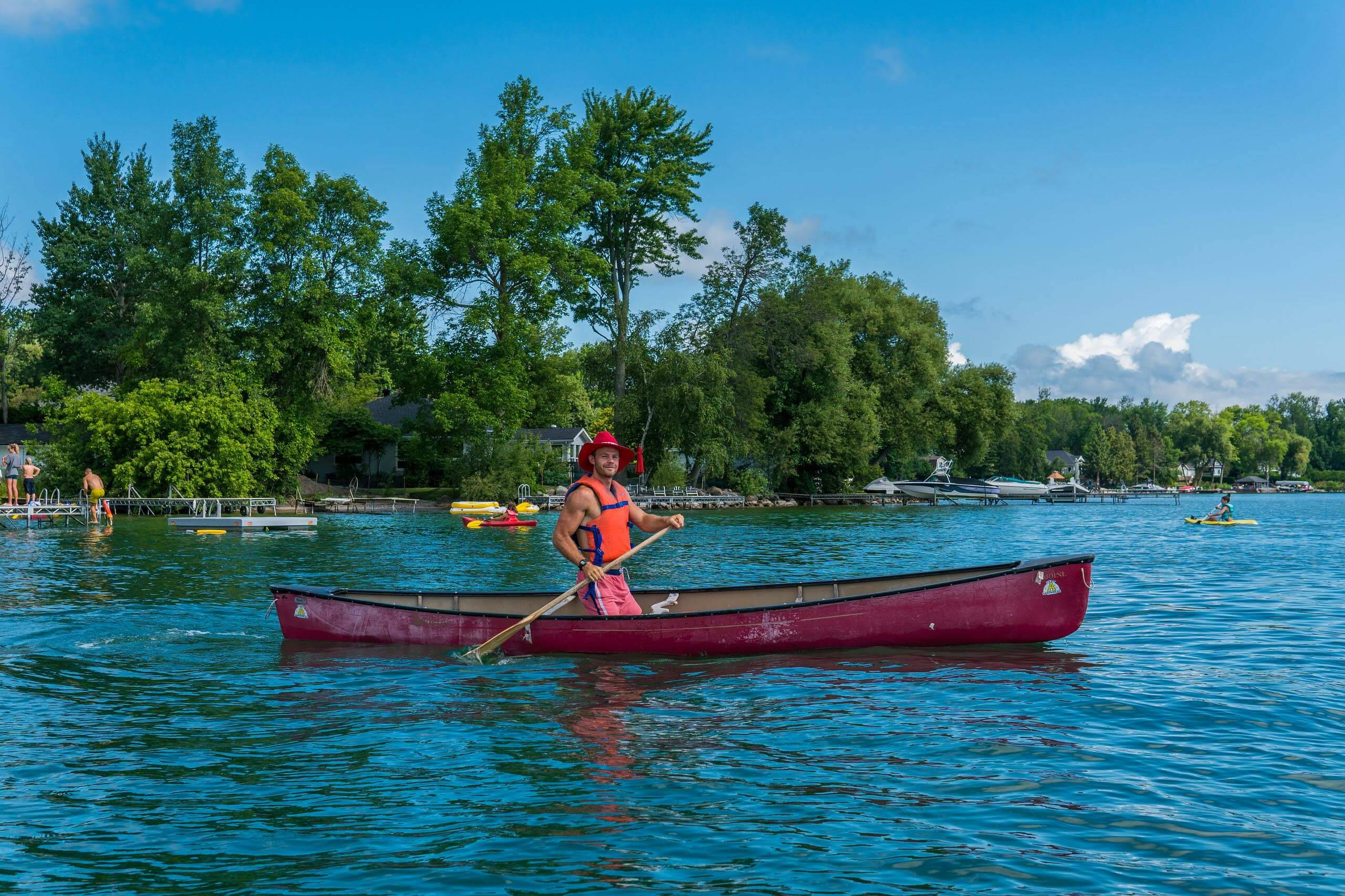 cowboy hat, red canoe, bright blue lake, 2K Desktop Wallpaper