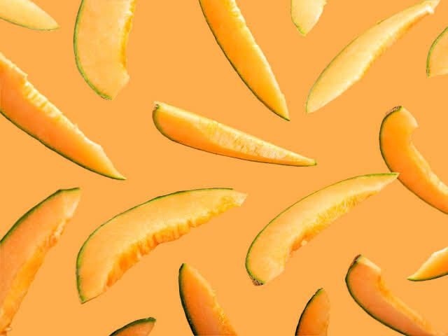 cantaloupe slices, warm orange background, vibrant tropical pattern, SD Desktop Wallpaper