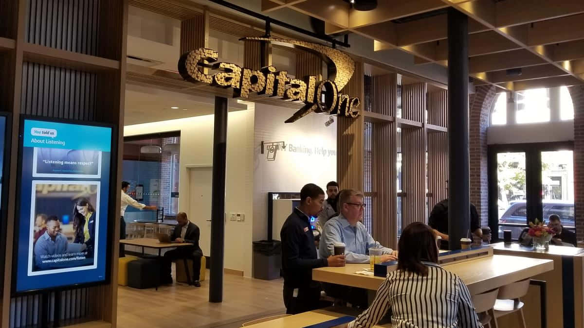 Capital One, modern bank interior, sleek wooden tables, SD Desktop Wallpaper
