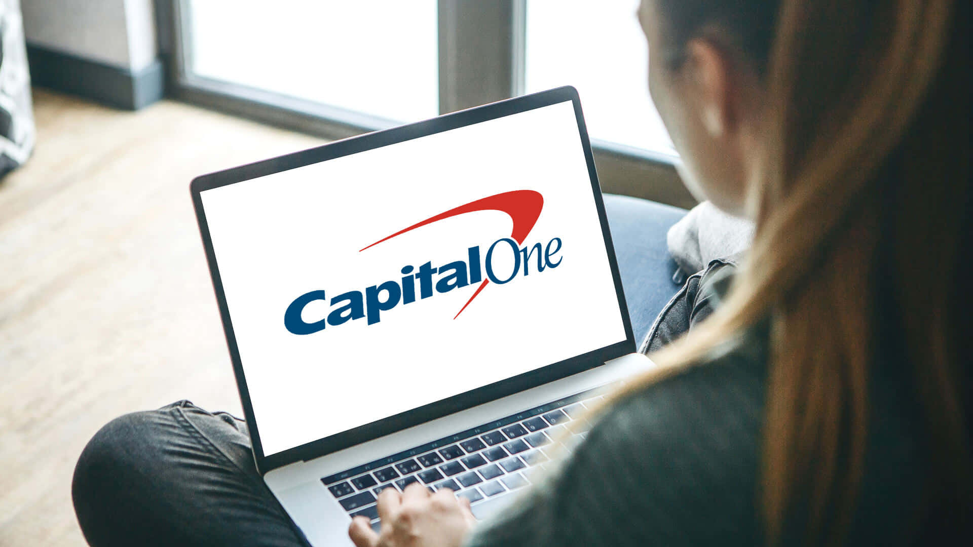 Capital One logo, laptop screen, couch, Full HD Desktop Wallpaper