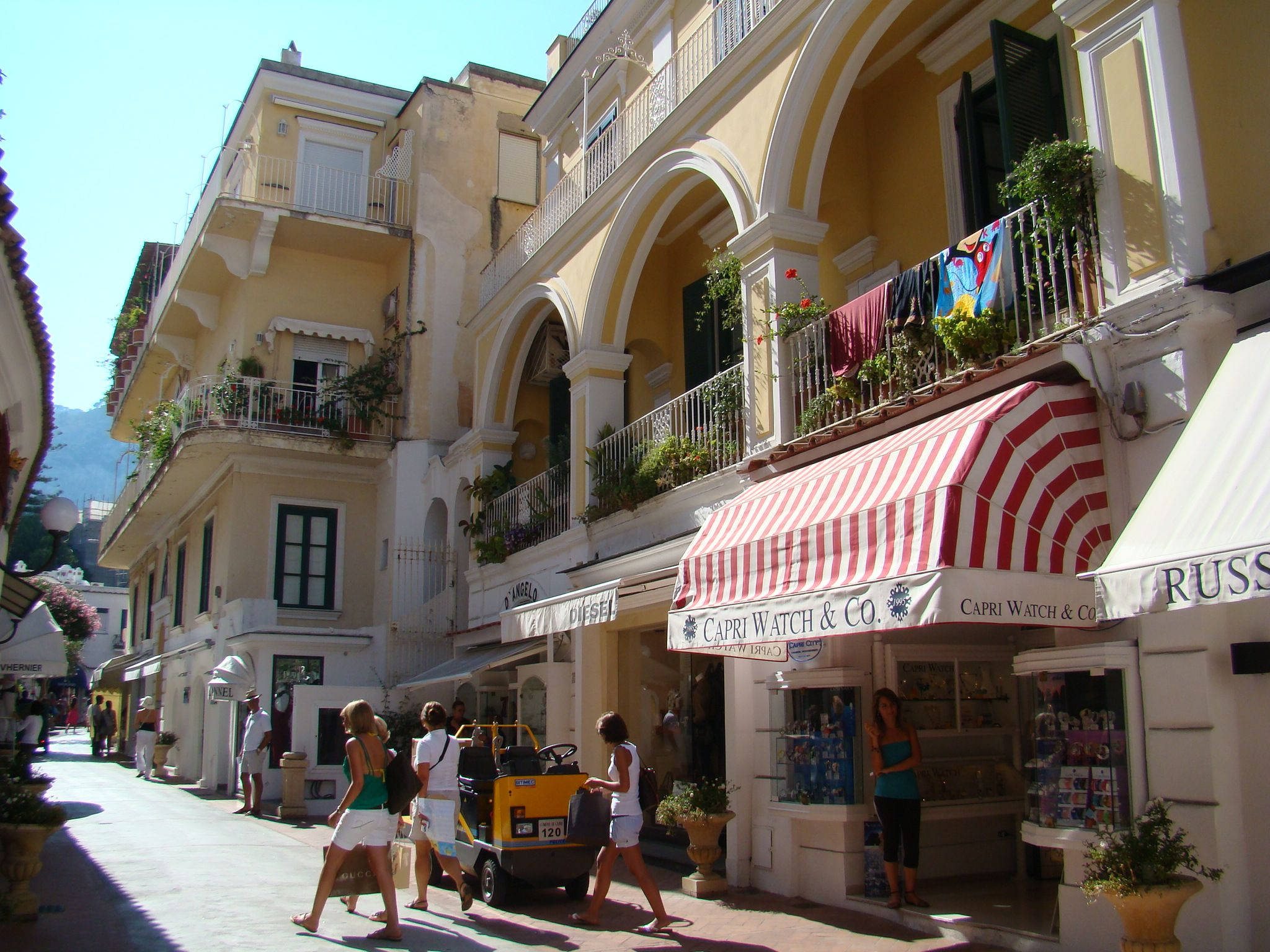 Capri Italy, cream painted houses, sunlit cobblestone street, Full HD Desktop Wallpaper
