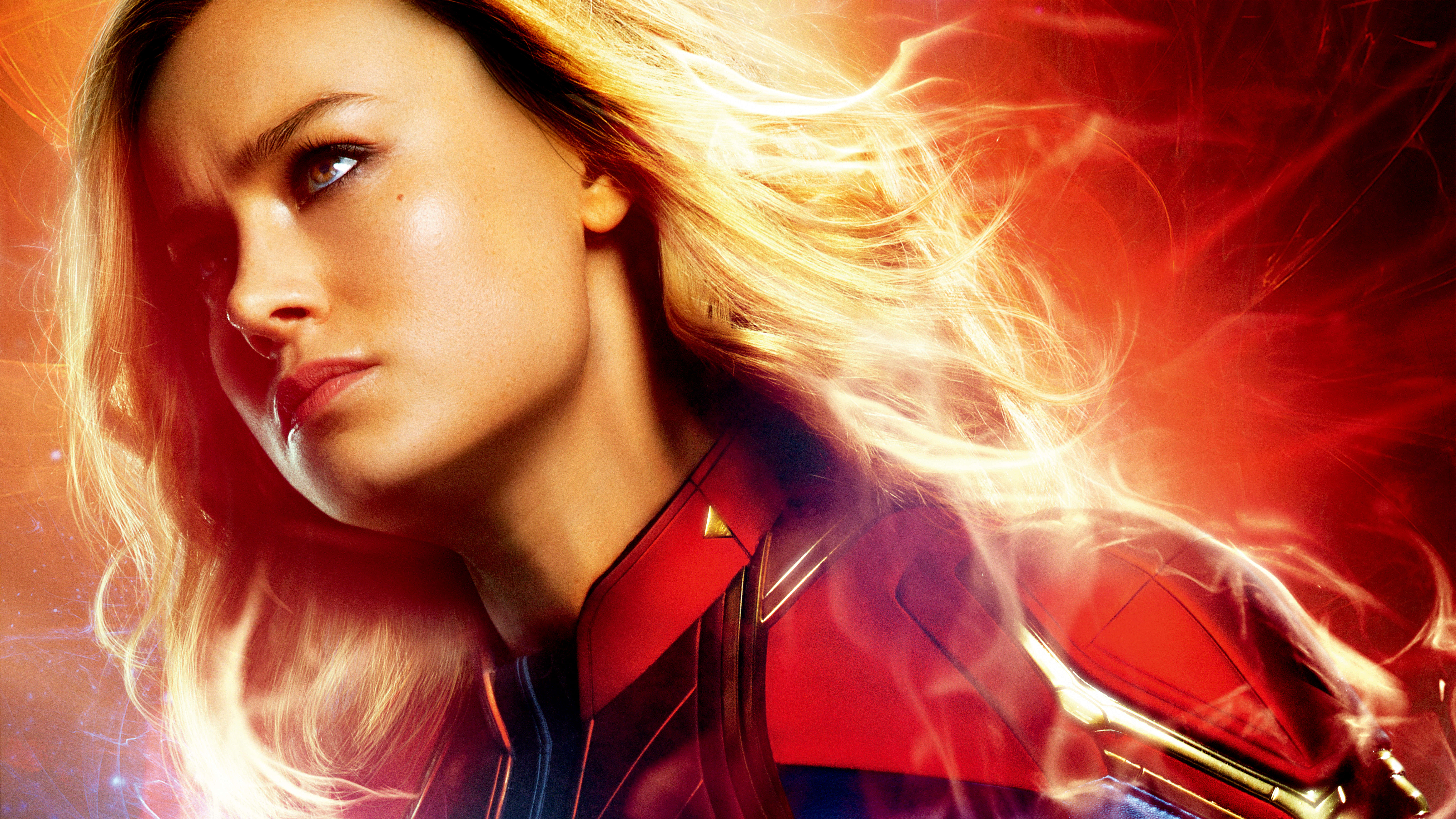 Captain Marvel, red and blue suit, glowing energy, 8K Desktop Wallpaper