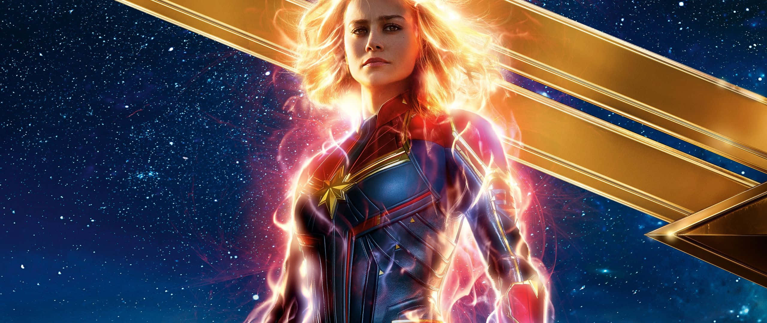 Captain Marvel, starry cosmic backdrop, golden energy streaks, 2K Desktop Wallpaper