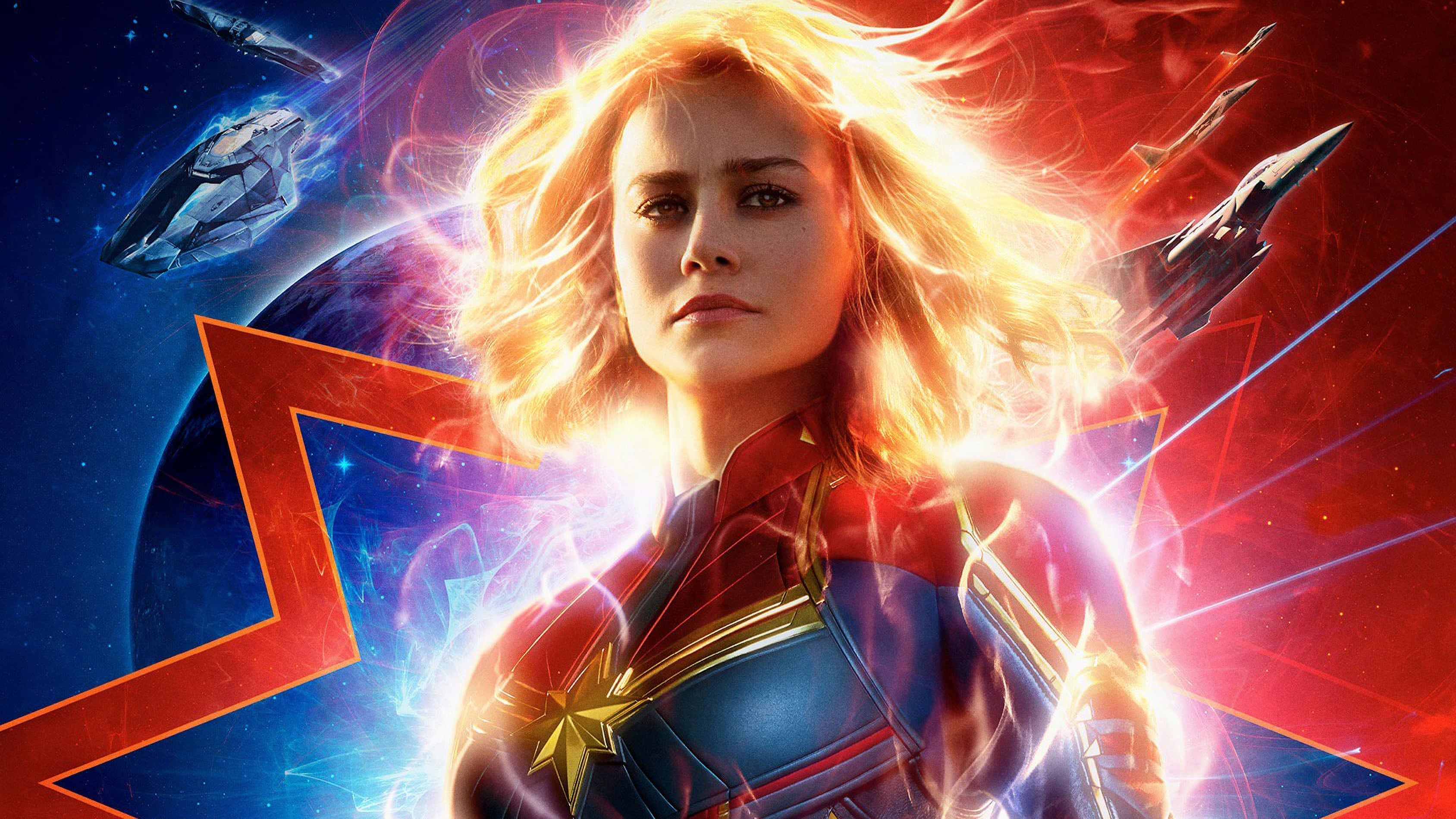 Captain Marvel, cosmic setting, glowing energy, 2K Desktop Wallpaper
